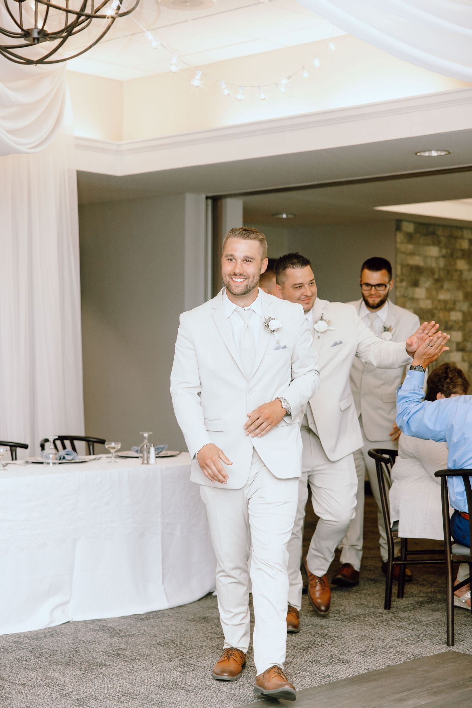 Wedding party entering reception at Lapeer Country Club wedding in Michigan