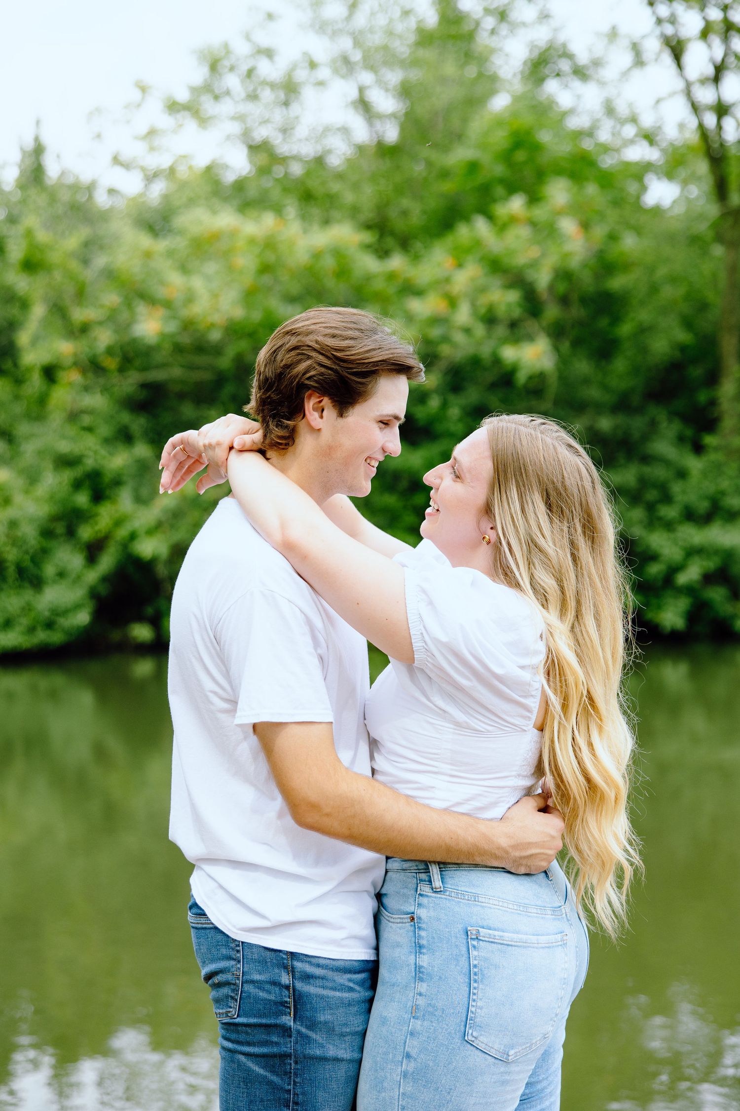 Engaged couple embracing at Greenfield Village in Dearborn, MI