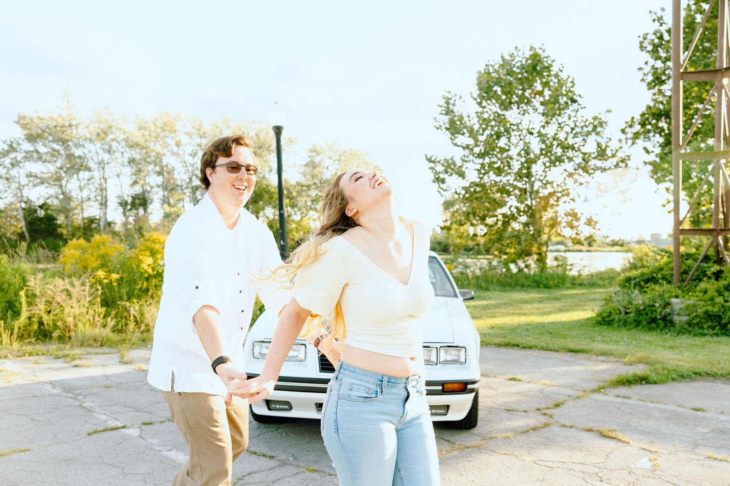Engaged couple swing dancing at Belle Isle summer engagement session in Detroit, MI