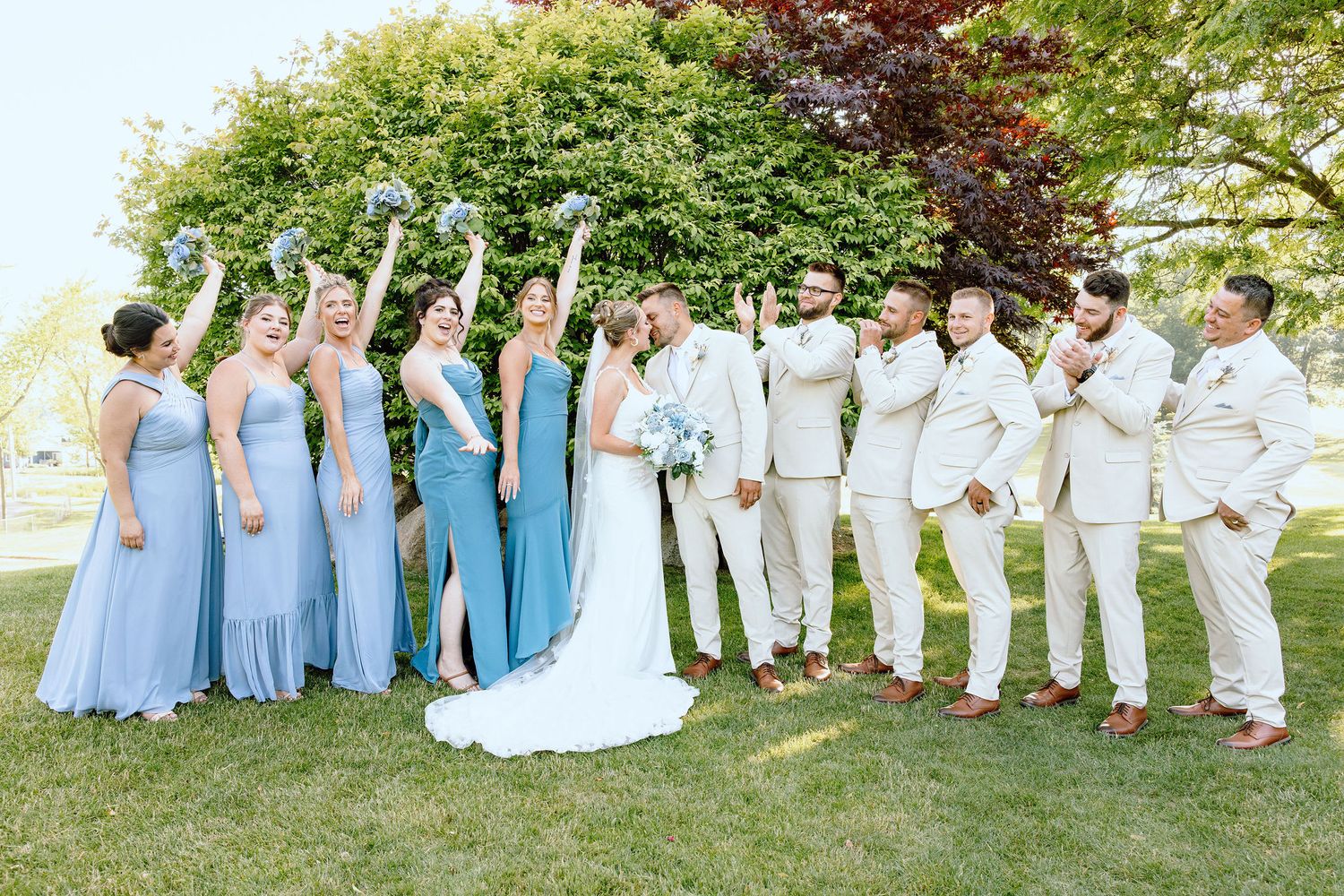 Wedding party cheering at Lapeer Country Club wedding in Michigan