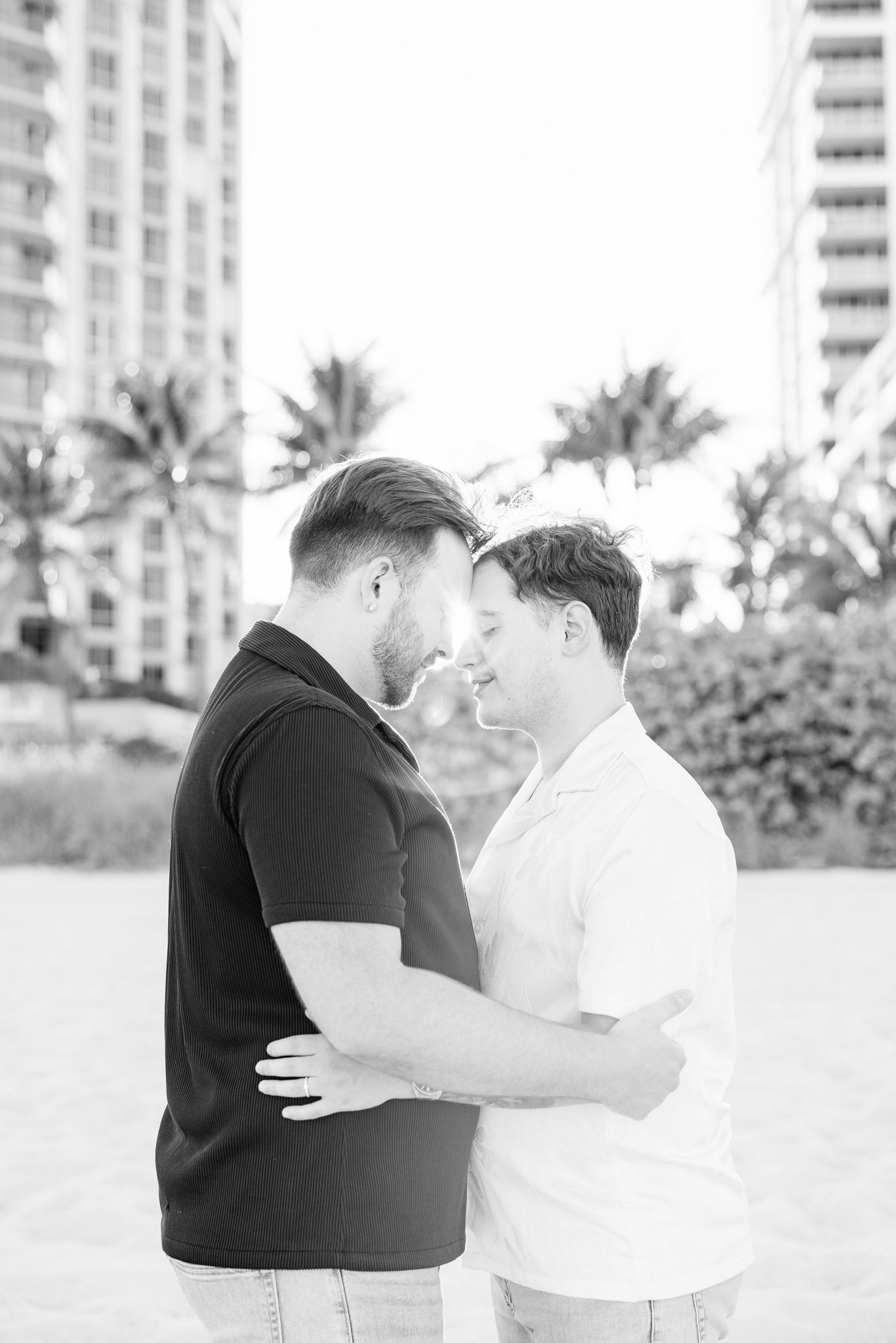 Gay couple touching foreheads at North Miami Beach in Florida