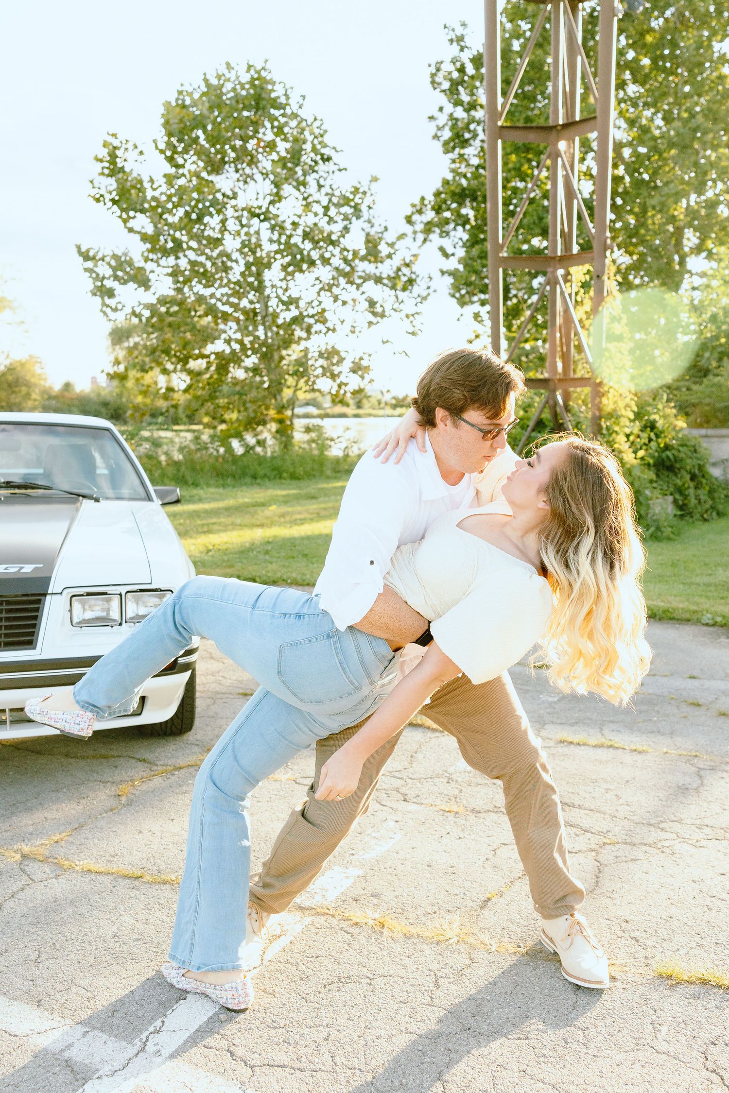 Engaged couple swing dancing at Belle Isle summer engagement session in Detroit, MI