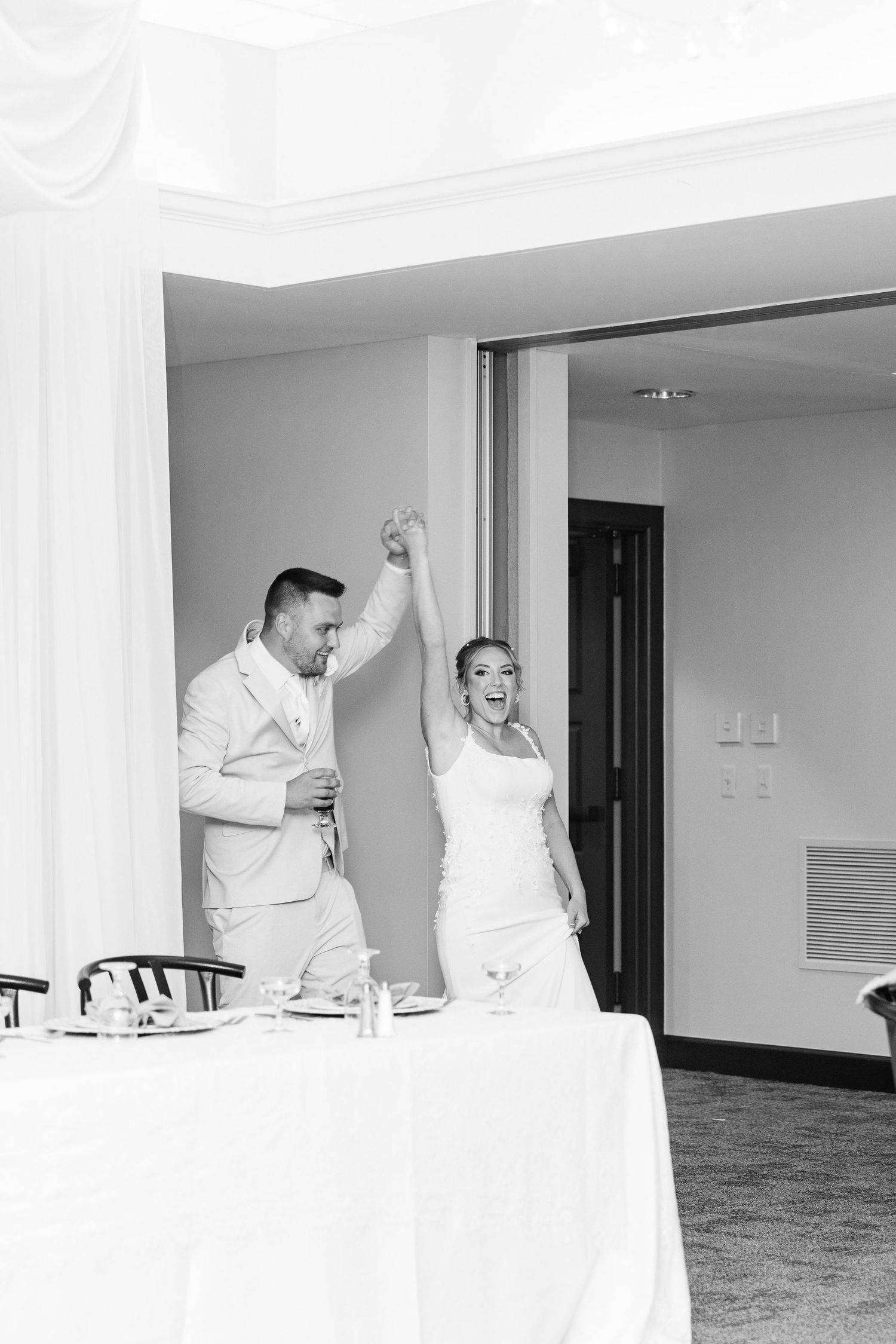 Married couple entering reception at Lapeer Country Club wedding in Michigan