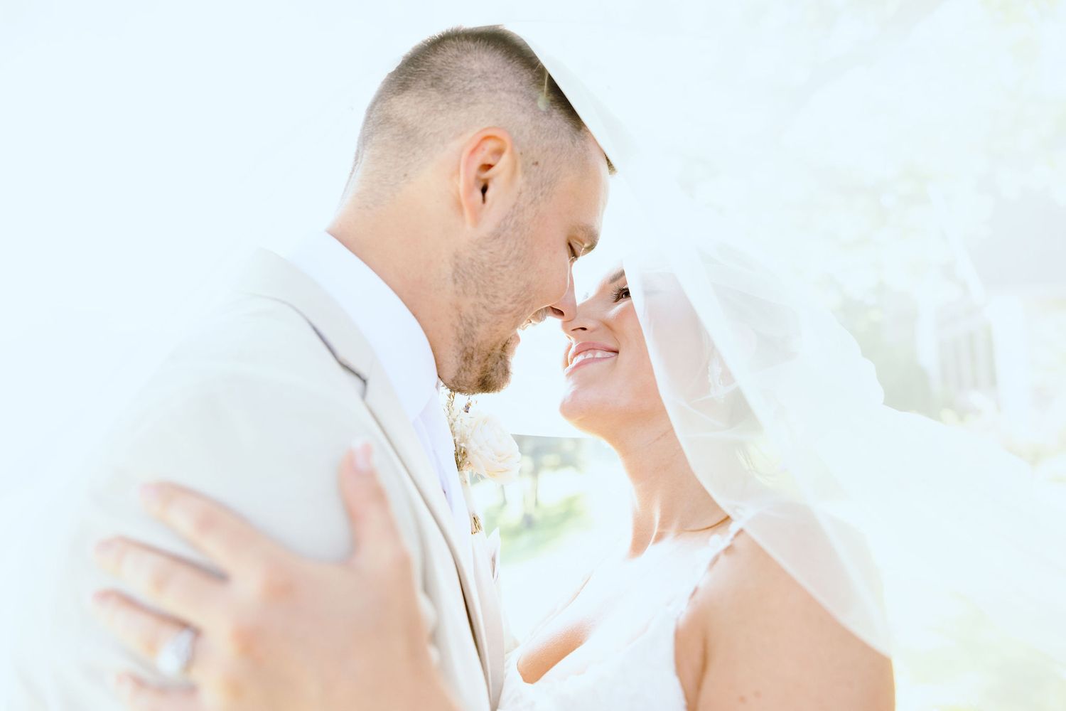Married couple embracing at Lapeer Country Club wedding in Michigan