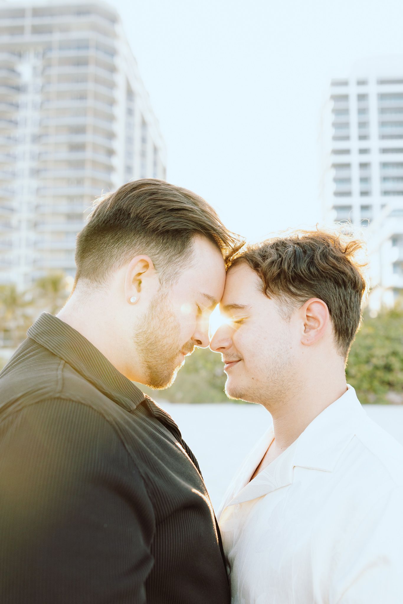 Gay couple touching foreheads at North Miami Beach in Florida