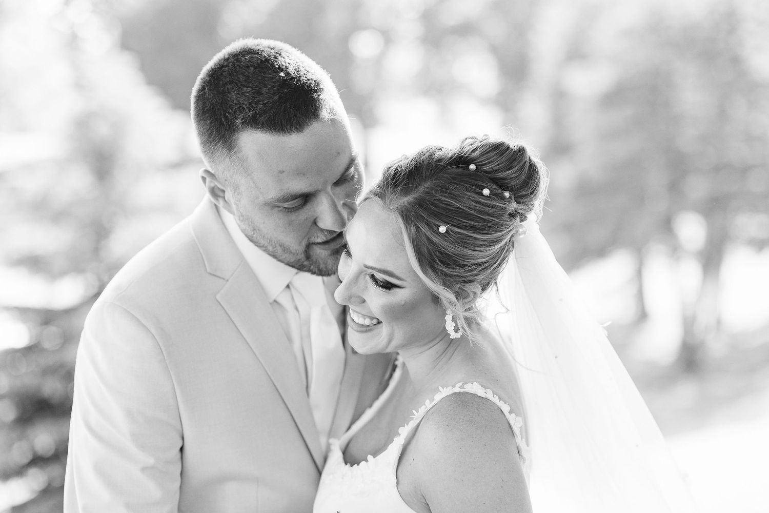 Married couple embracing at Lapeer Country Club wedding in Michigan