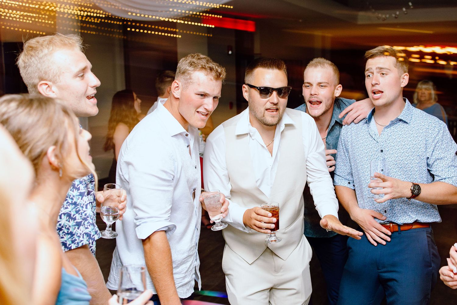 Groom dancing during reception at Lapeer Country Club wedding in Michigan