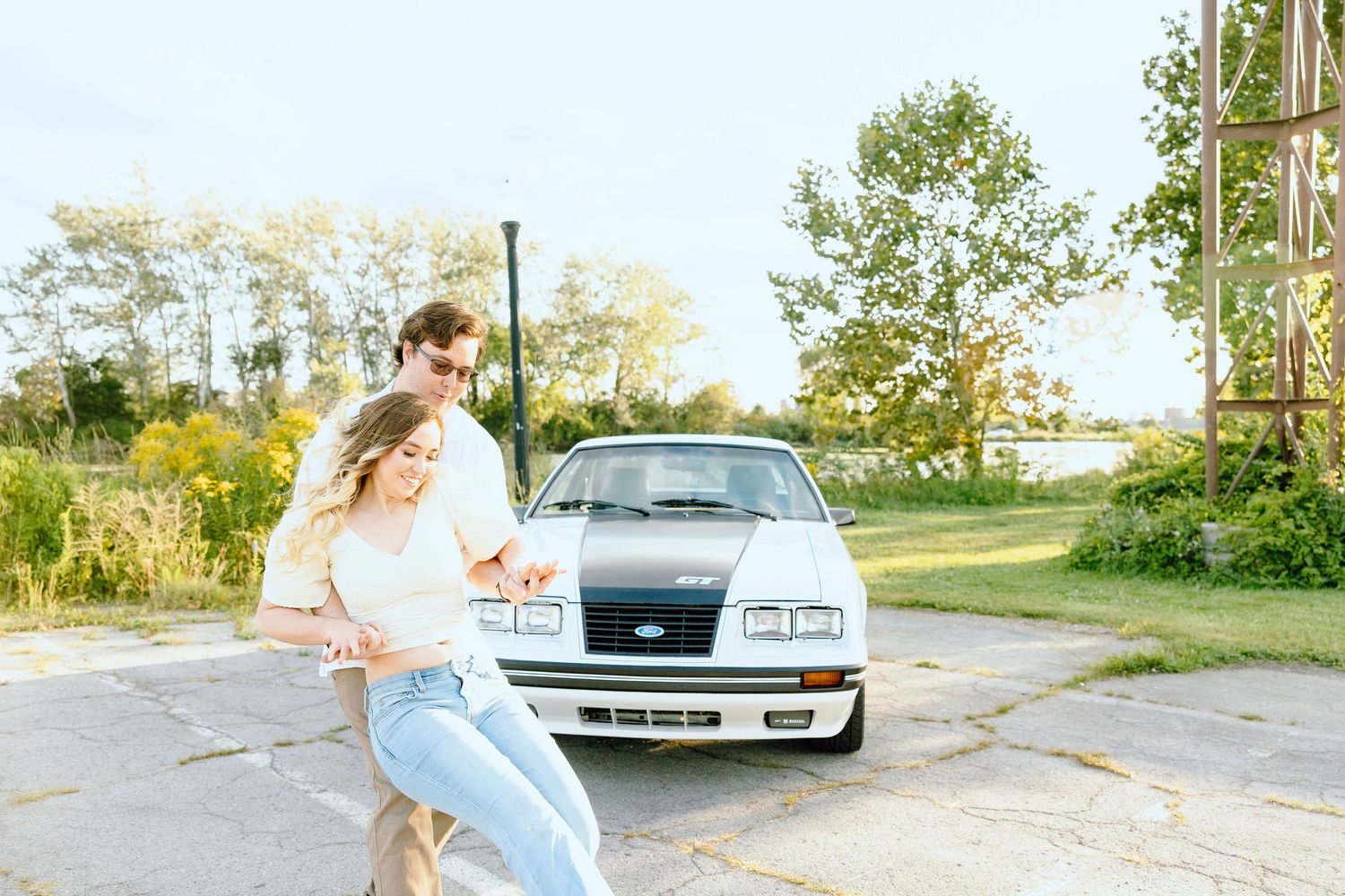 Engaged couple swing dancing at Belle Isle summer engagement session in Detroit, MI