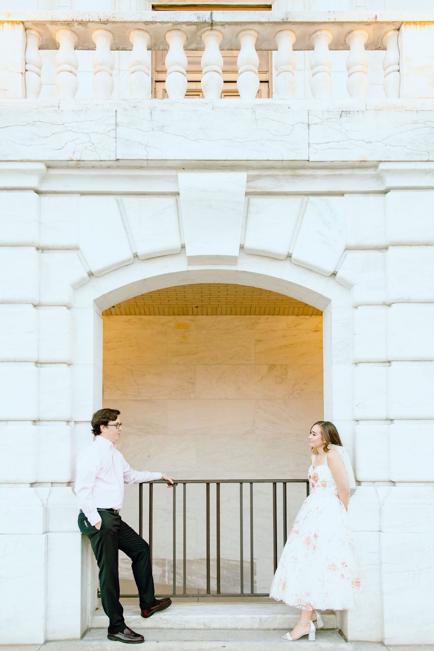 Couple leaning against wall at Detroit Institute of Arts in Michigan