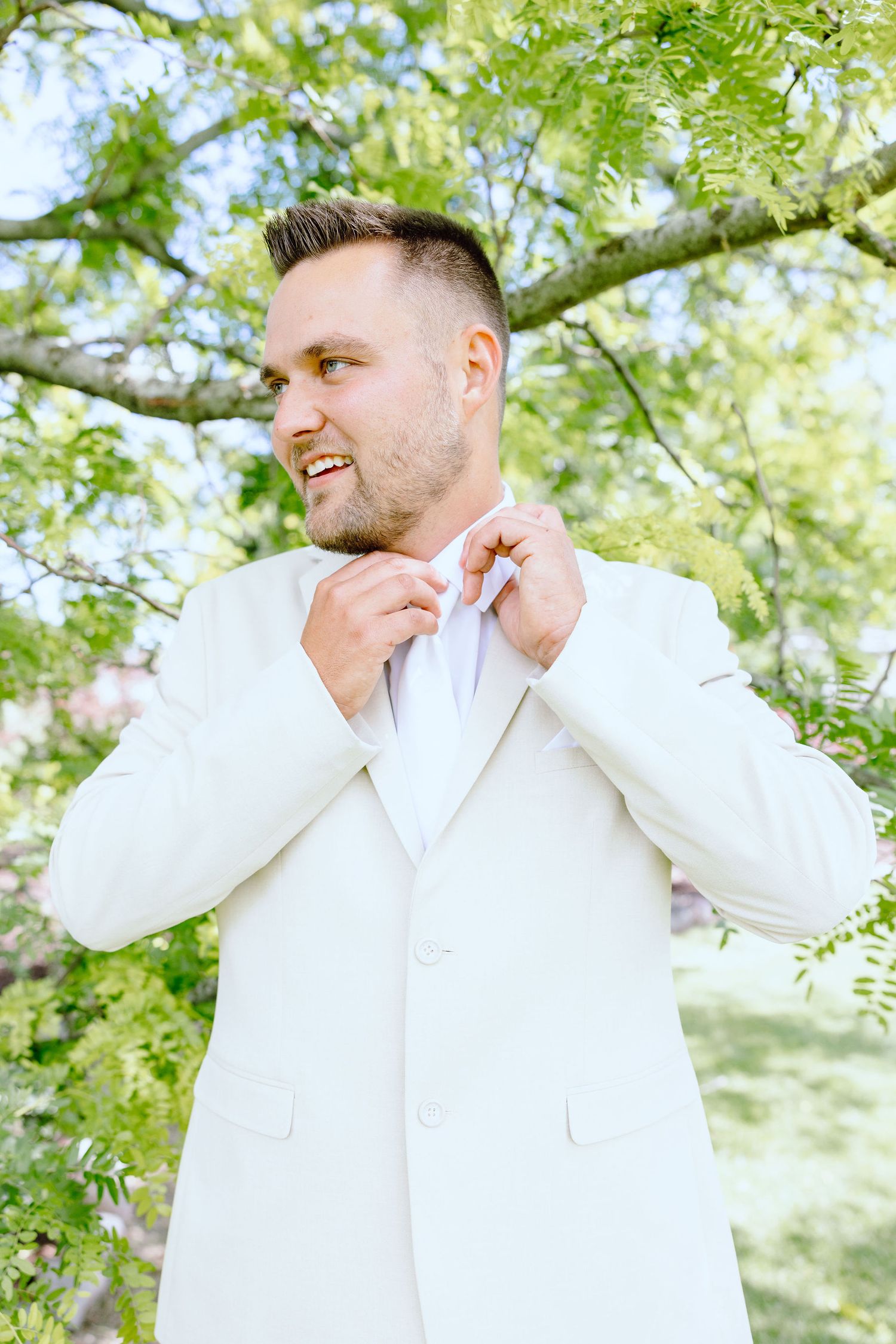 Portraits of groom at Lapeer Country Club wedding in Michigan