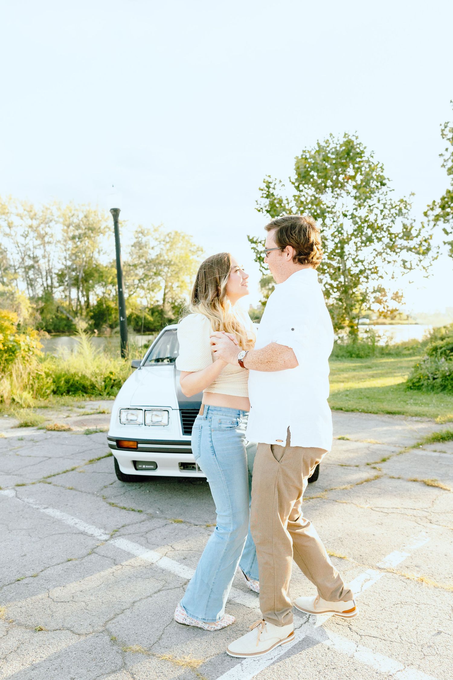 Engaged couple swing dancing at Belle Isle summer engagement session in Detroit, MI