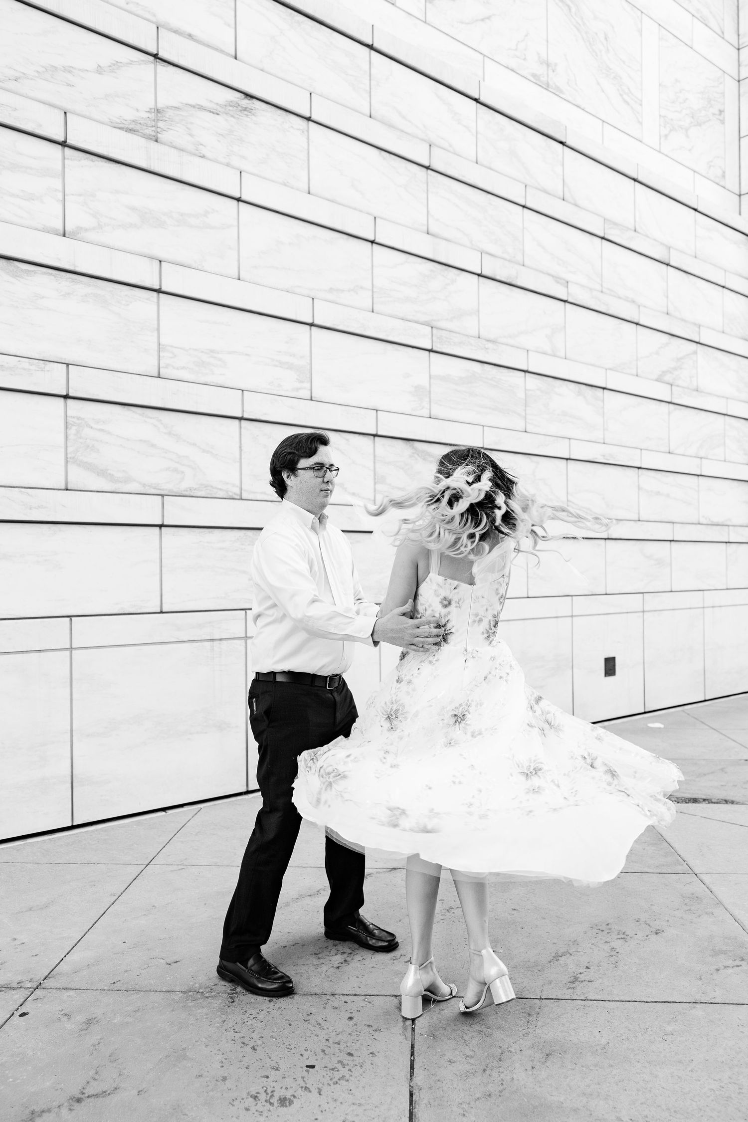 Engaged couple swing dancing at Detroit Institute of Arts engagement session in Detroit, MI