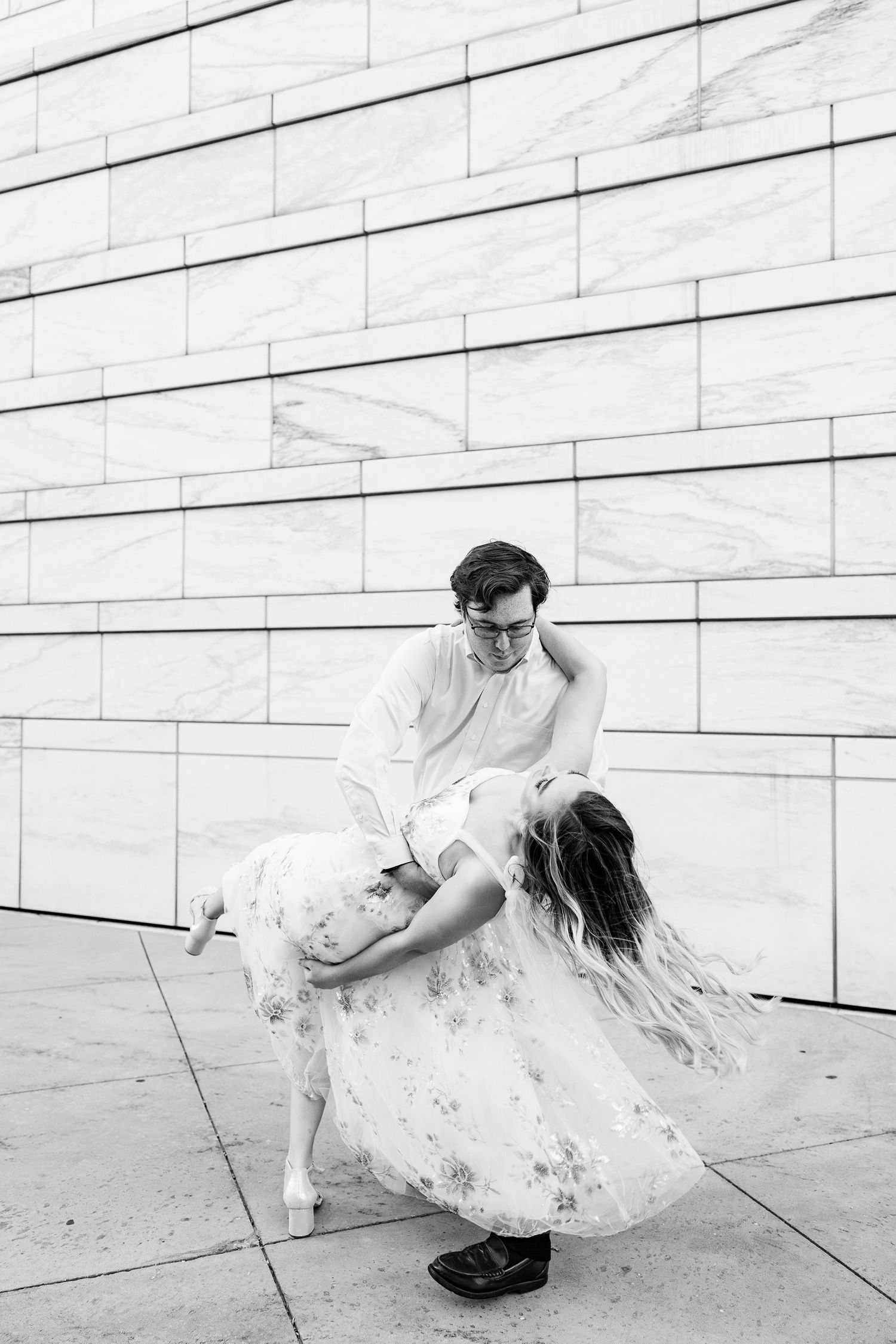 Engaged couple swing dancing at Detroit Institute of Arts engagement session in Detroit, MI