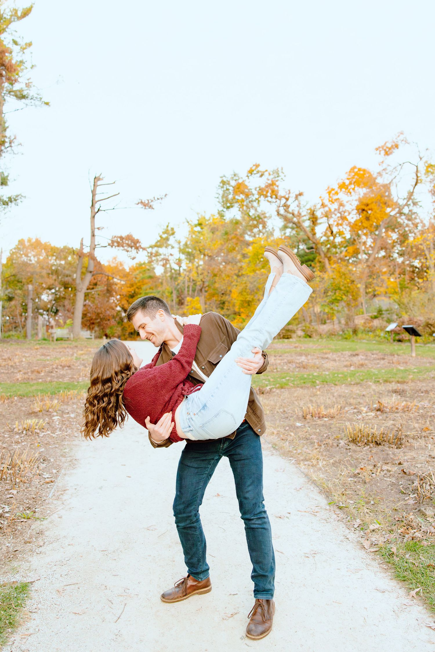 Man lifting woman at Nichols Arboretum in Ann Arbor, MI