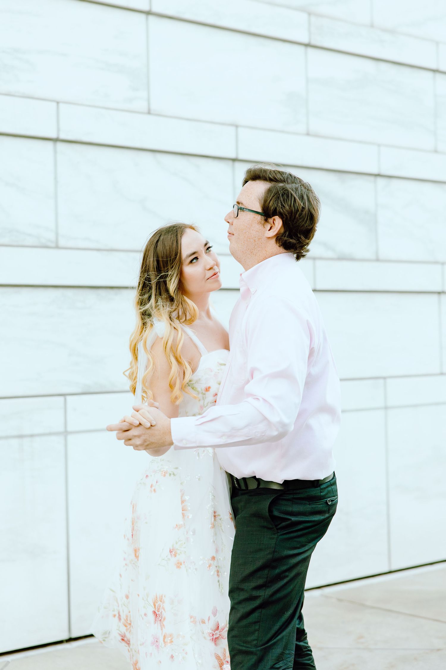 Engaged couple swing dancing at Detroit Institute of Arts engagement session in Detroit, MI