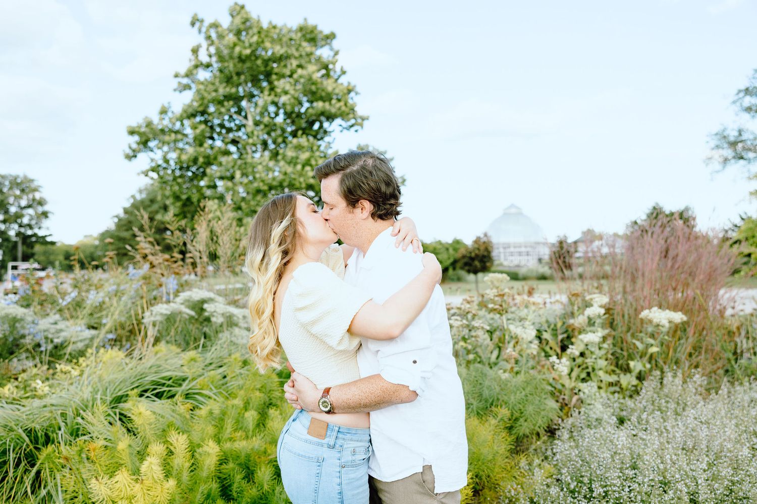 Engaged couple kissing at Belle Isle in Detroit, MI