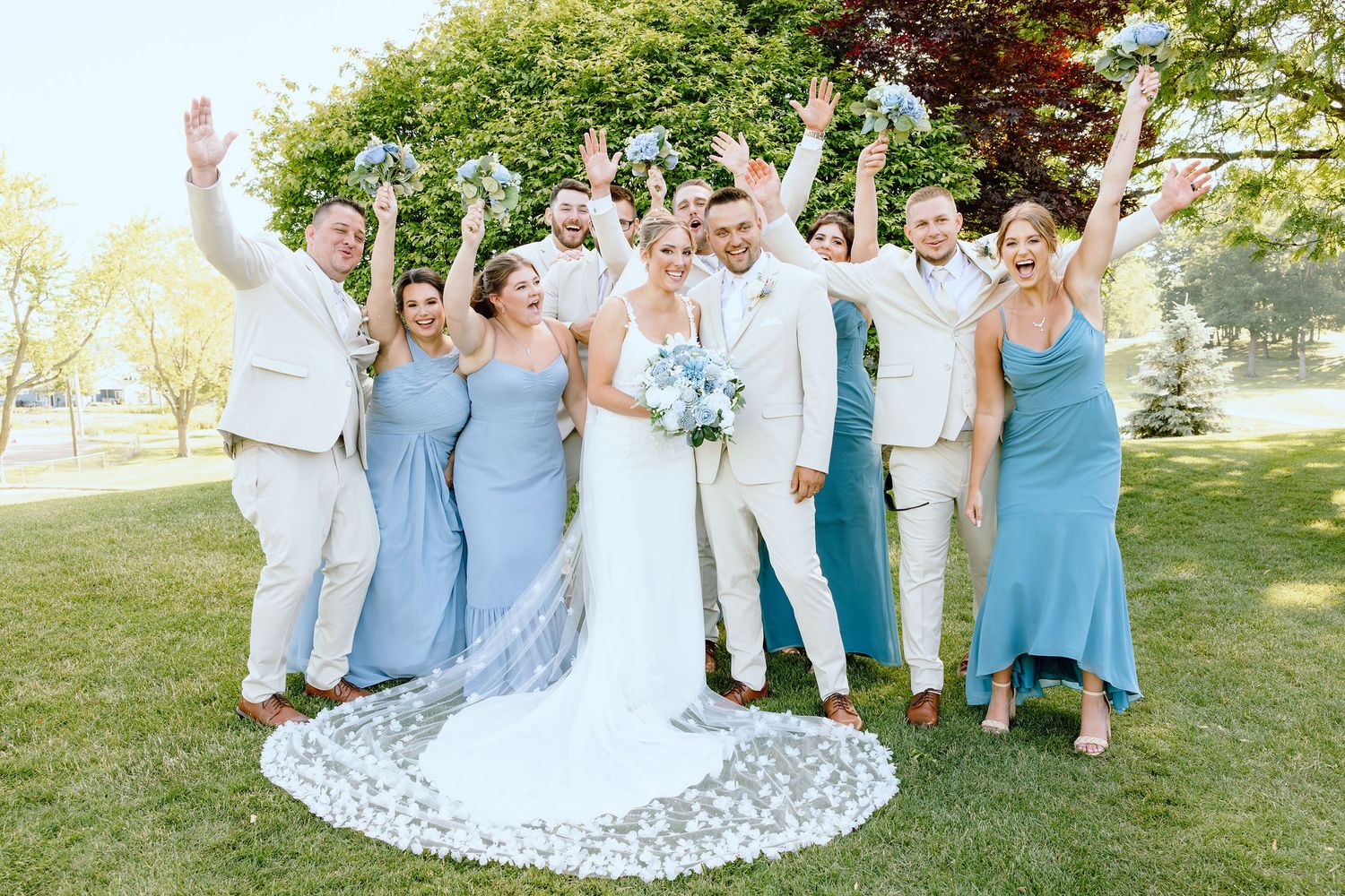 Wedding party cheering at Lapeer Country Club wedding in Michigan
