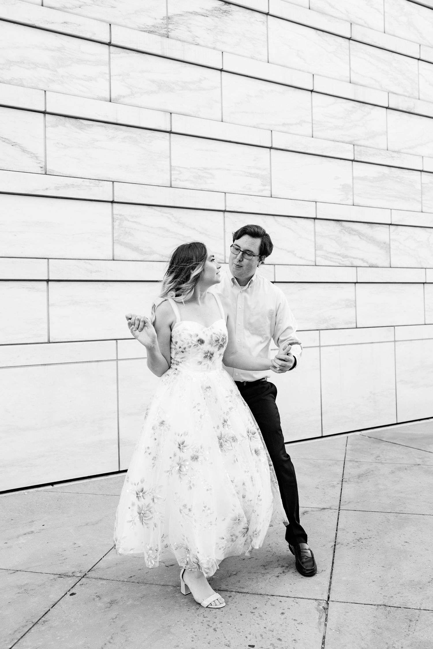 Engaged couple swing dancing at Detroit Institute of Arts engagement session in Detroit, MI