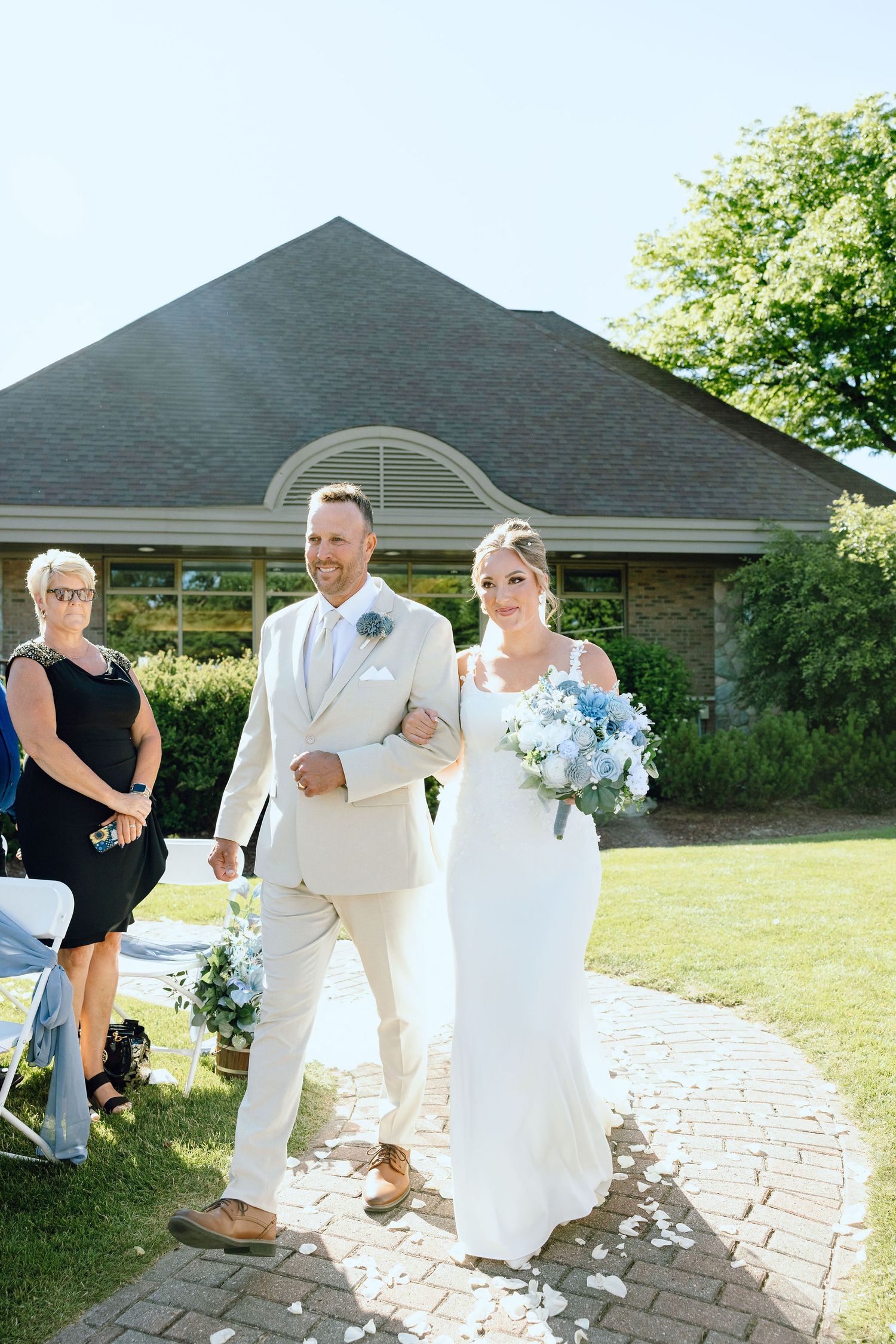 Bride walking down aisle at Lapeer Country Club wedding in Michigan