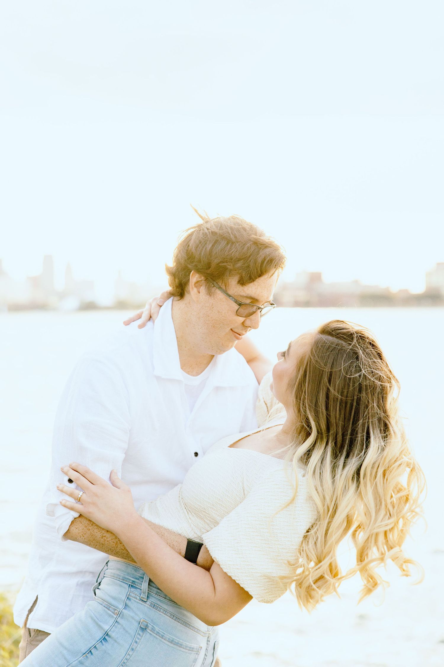 Engaged couple dipping at Belle Isle summer engagement session in Detroit, MI