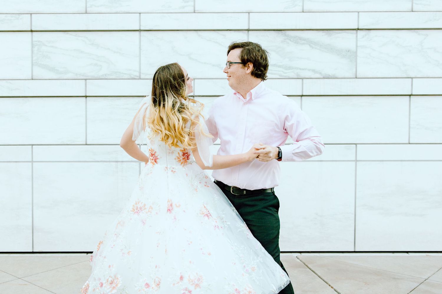 Engaged couple swing dancing at Detroit Institute of Arts engagement session in Detroit, MI
