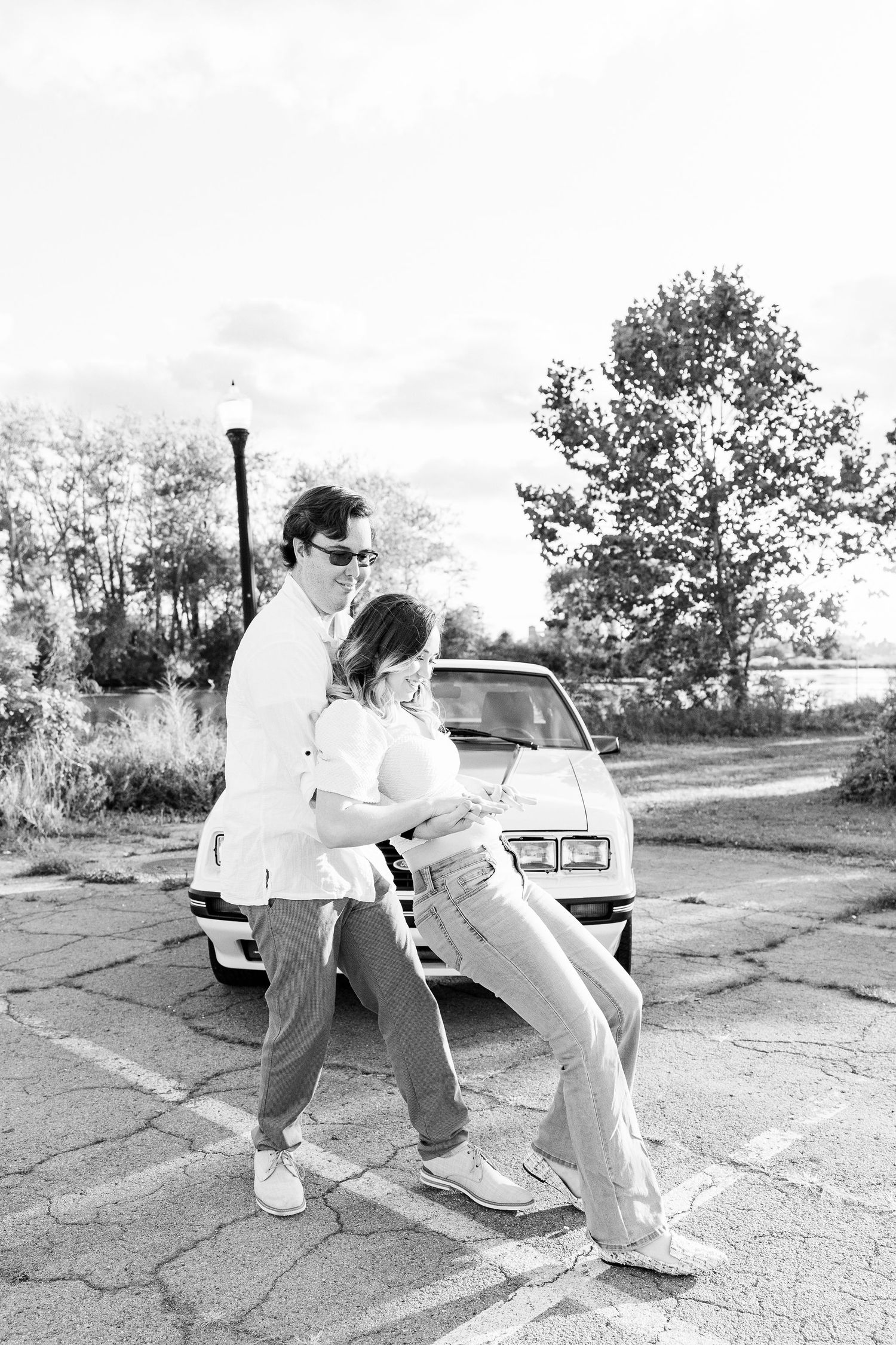 Engaged couple swing dancing at Belle Isle summer engagement session in Detroit, MI