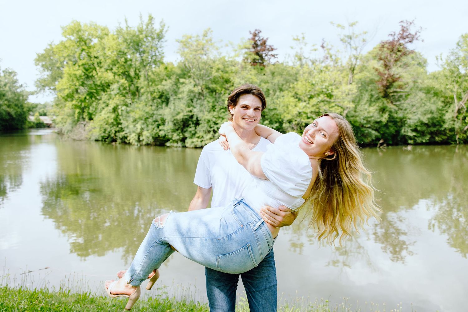 Man lifts his fiancé at Greenfield Village in Dearborn, MI