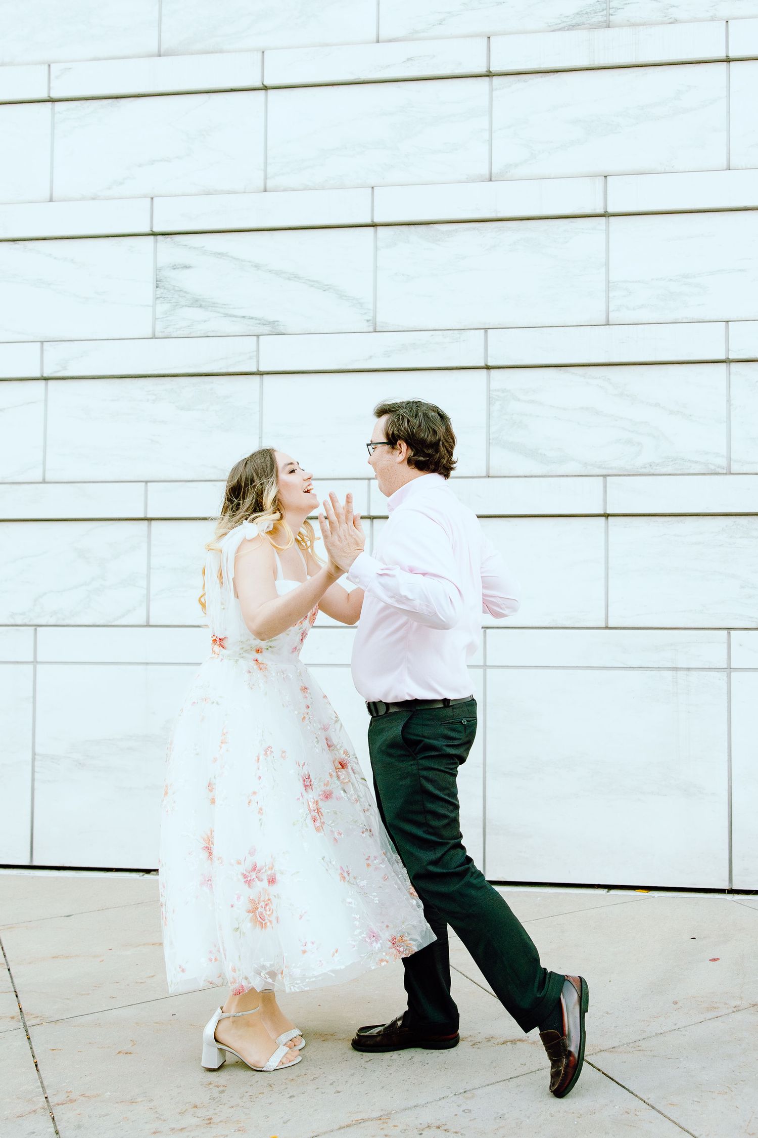 Engaged couple swing dancing at Detroit Institute of Arts engagement session in Detroit, MI