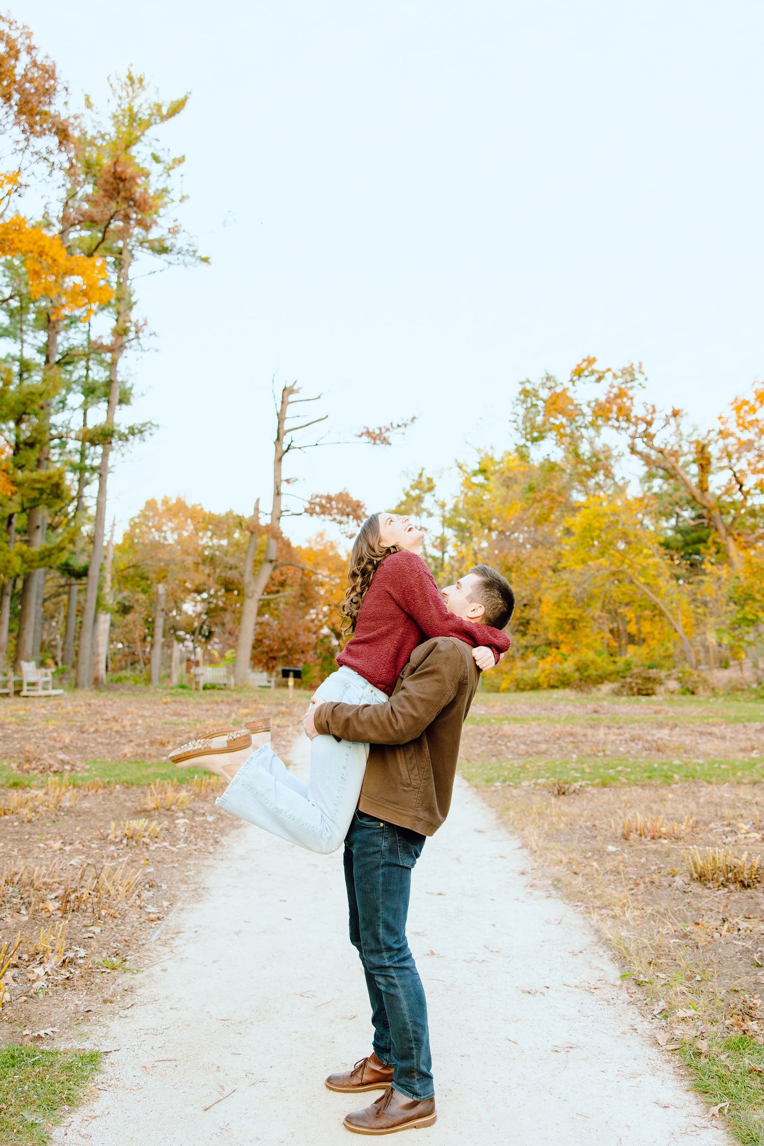 Man lifting woman at Nichols Arboretum in Ann Arbor, MI