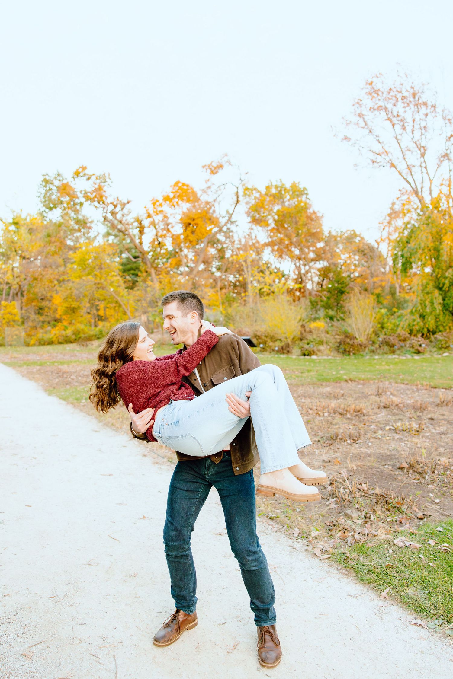 Man lifting woman at Nichols Arboretum in Ann Arbor, MI