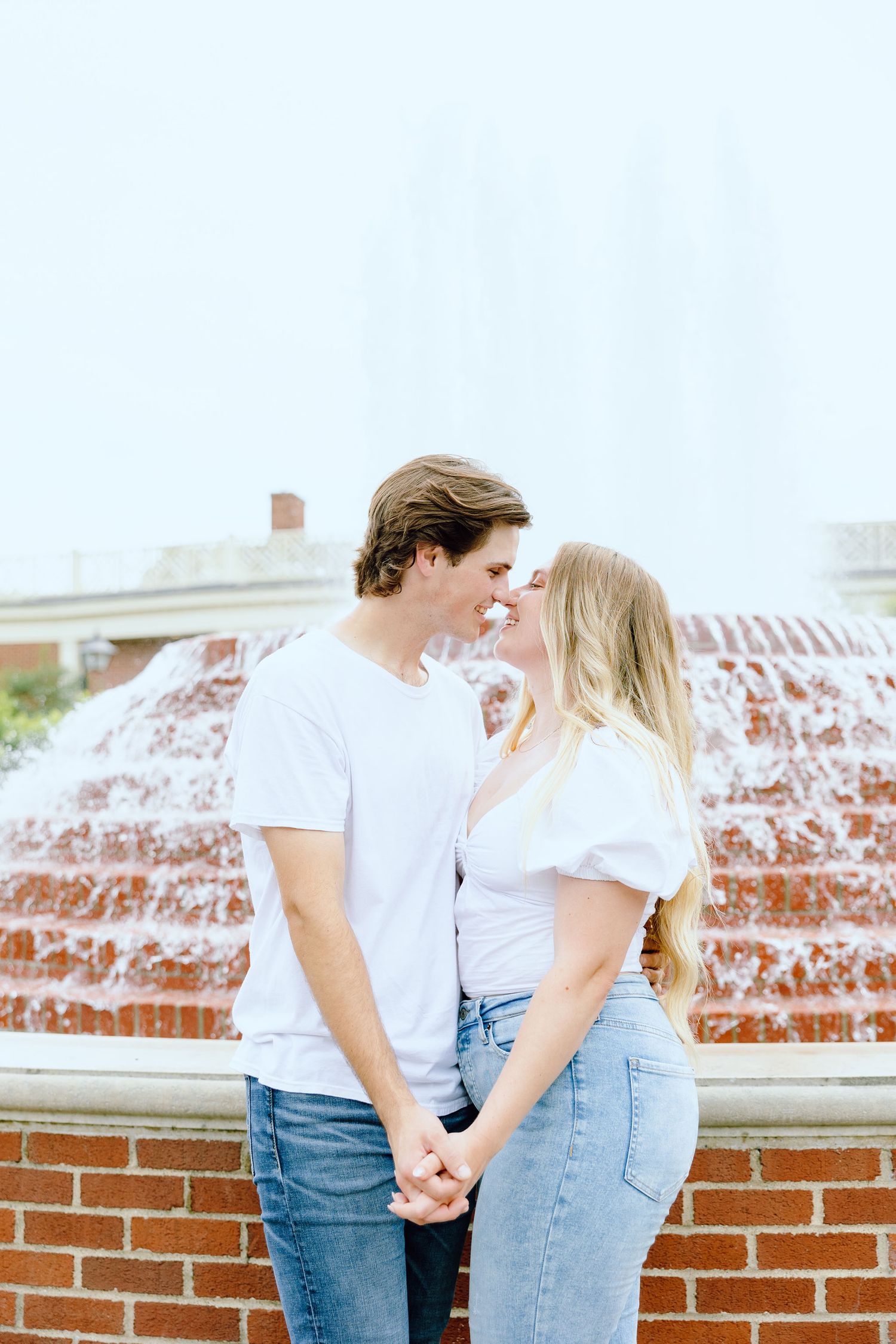 Engaged couple embracing at Greenfield Village in Dearborn, MI
