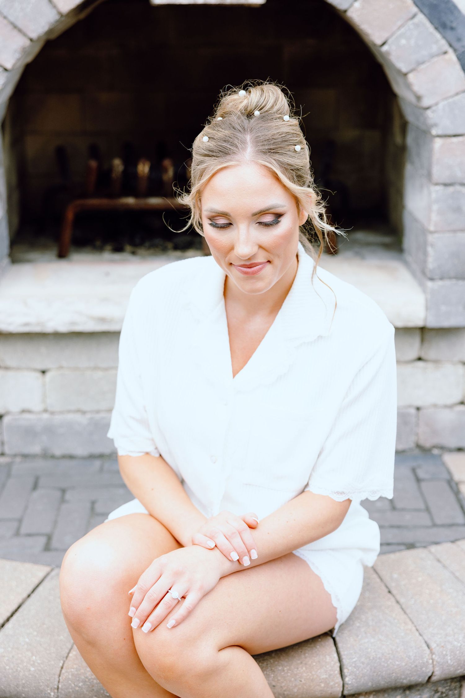 Bride in getting ready pajamas at Lapeer Country Club wedding in Michigan