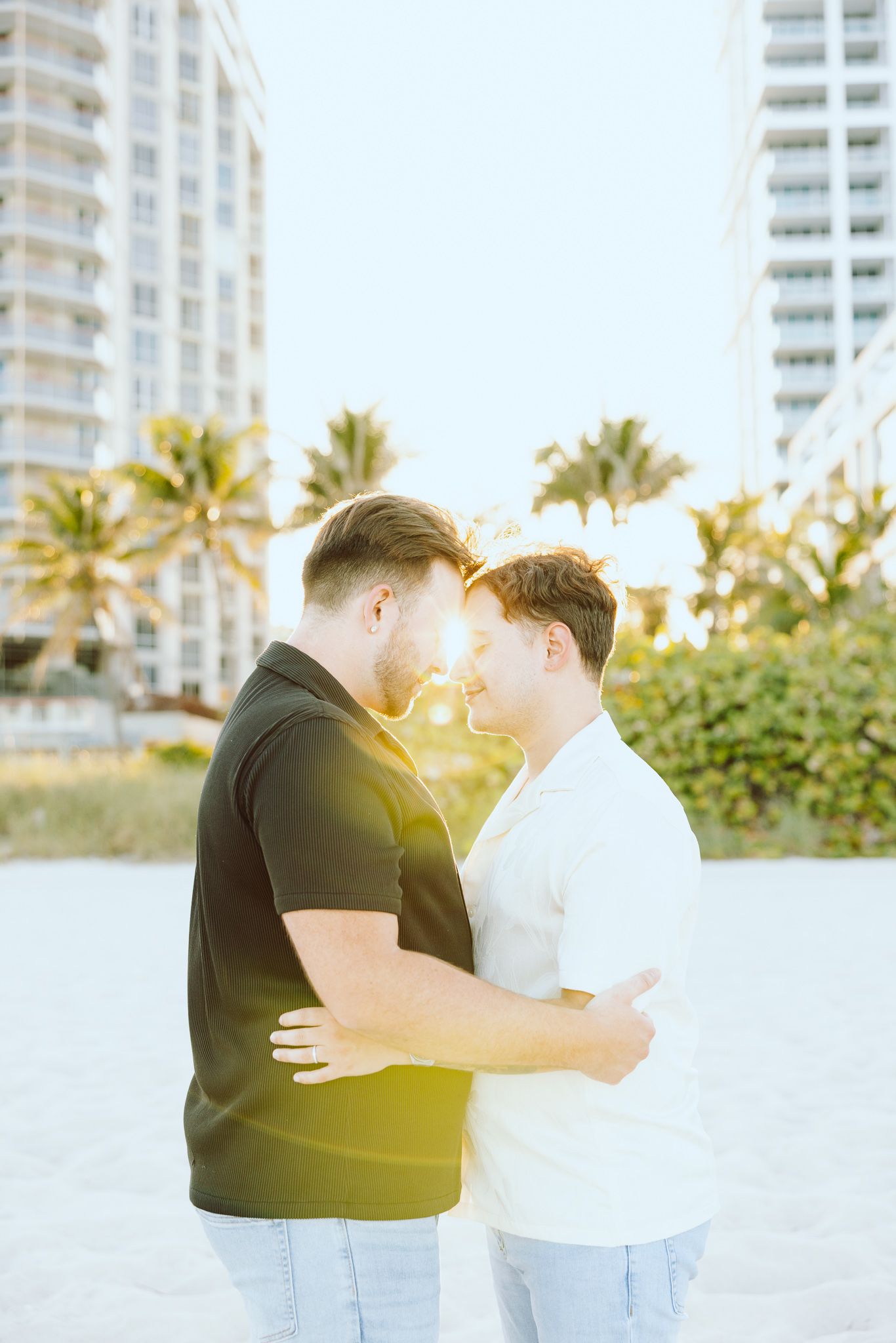Gay couple touching foreheads at North Miami Beach in Florida