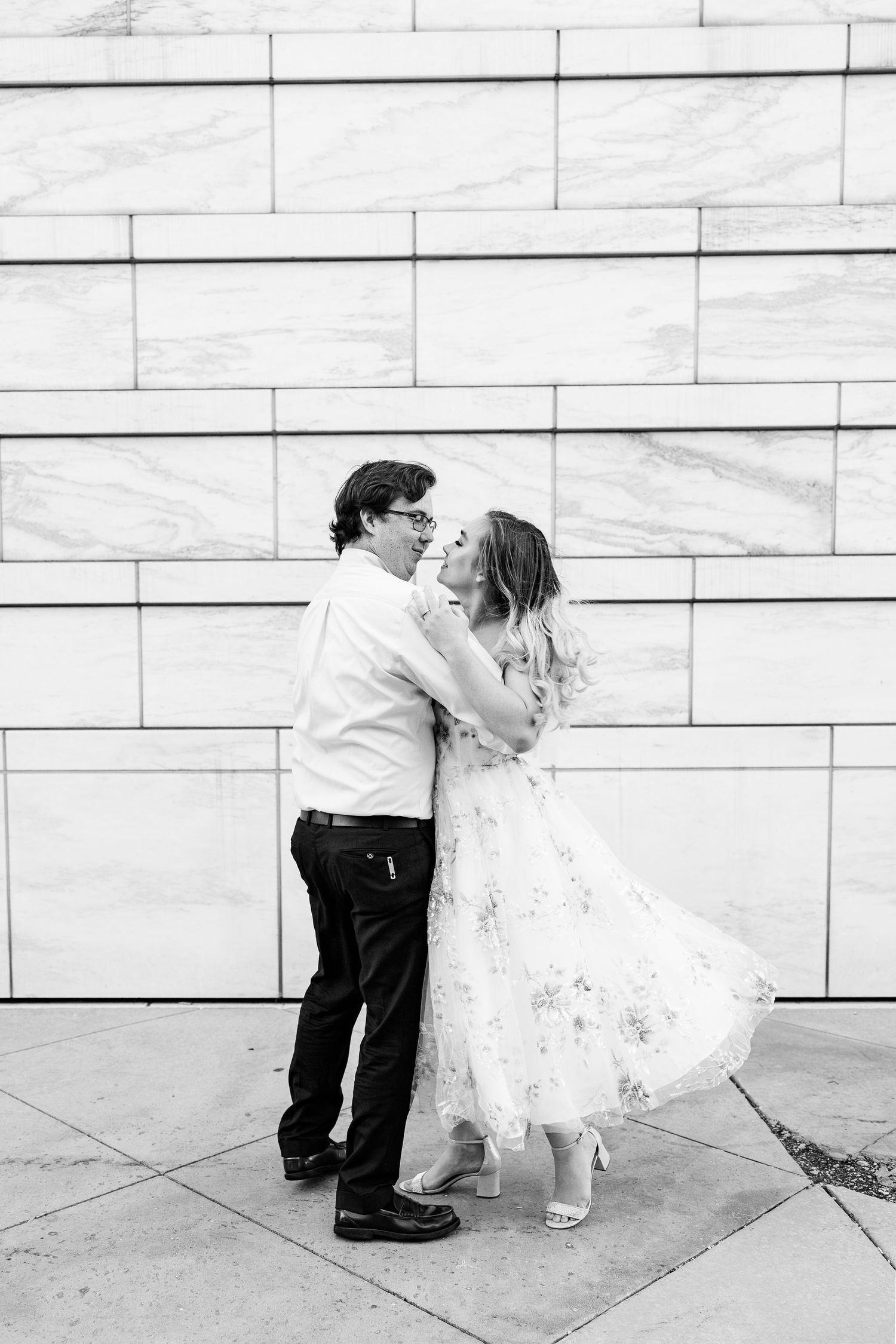 Engaged couple swing dancing at Detroit Institute of Arts engagement session in Detroit, MI