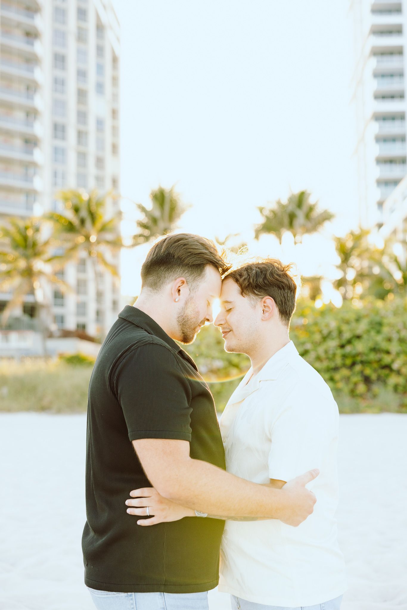 Gay couple touching foreheads at North Miami Beach in Florida
