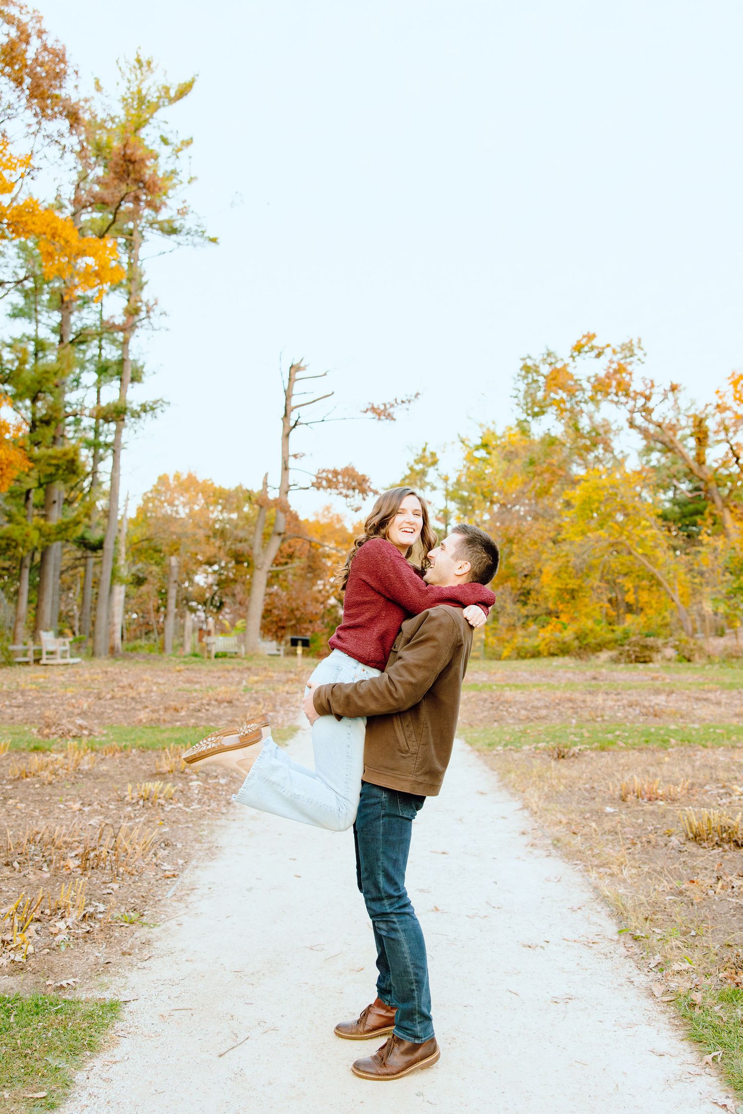 Man lifting woman at Nichols Arboretum in Ann Arbor, MI