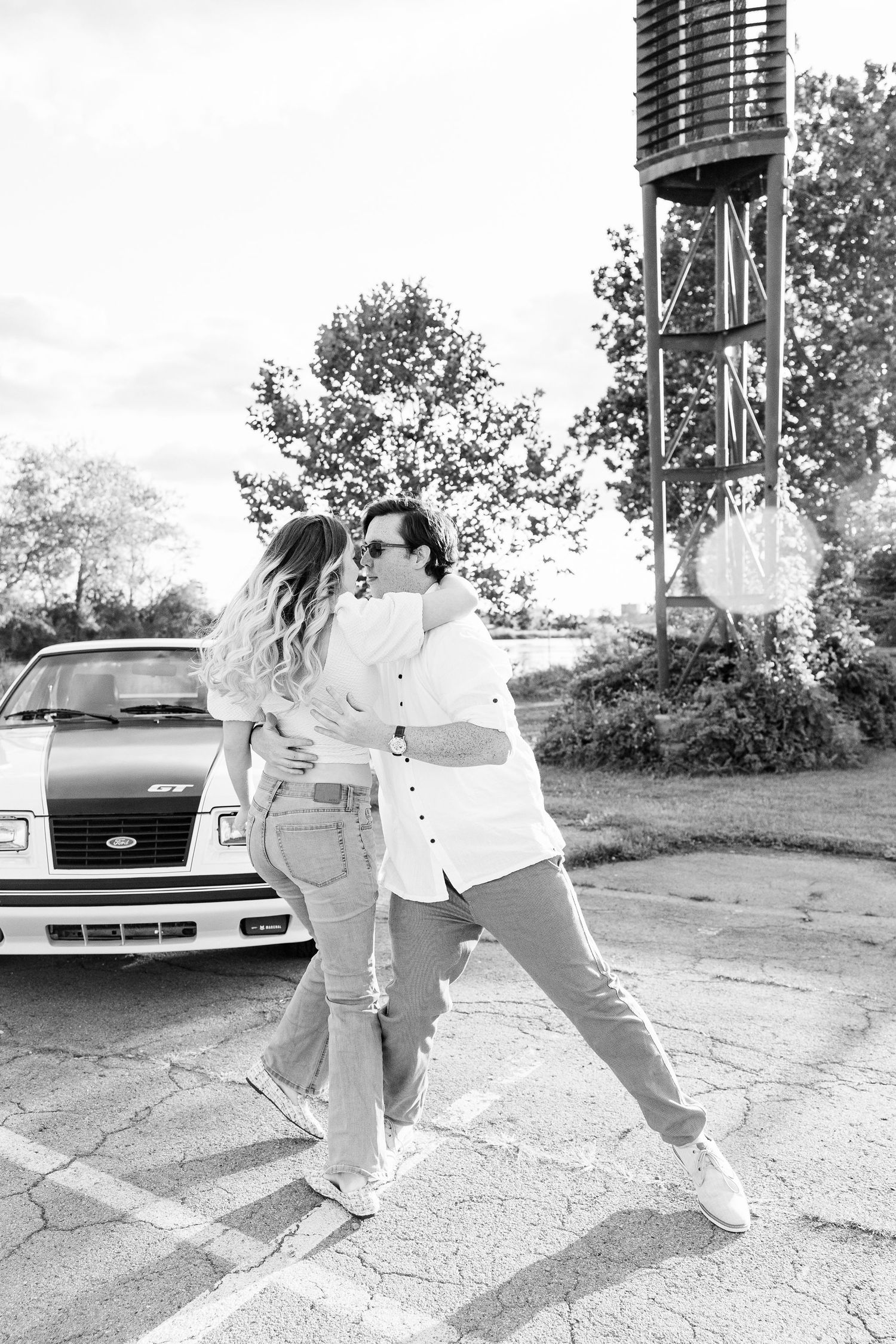Engaged couple swing dancing at Belle Isle summer engagement session in Detroit, MI