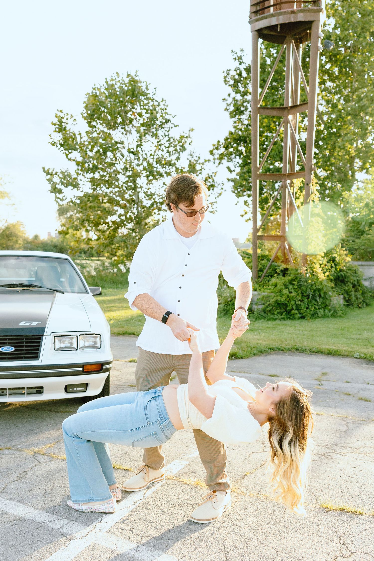 Engaged couple swing dancing at Belle Isle summer engagement session in Detroit, MI
