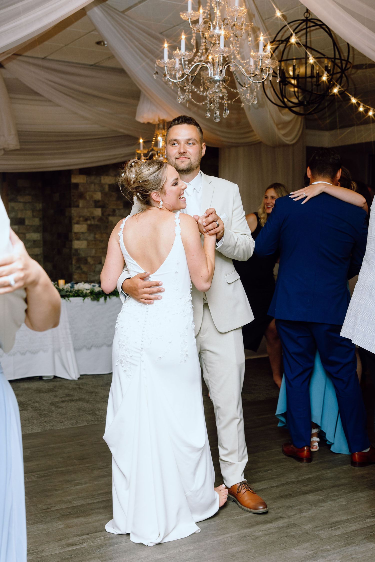 Married couple dancing during reception at Lapeer Country Club wedding in Michigan