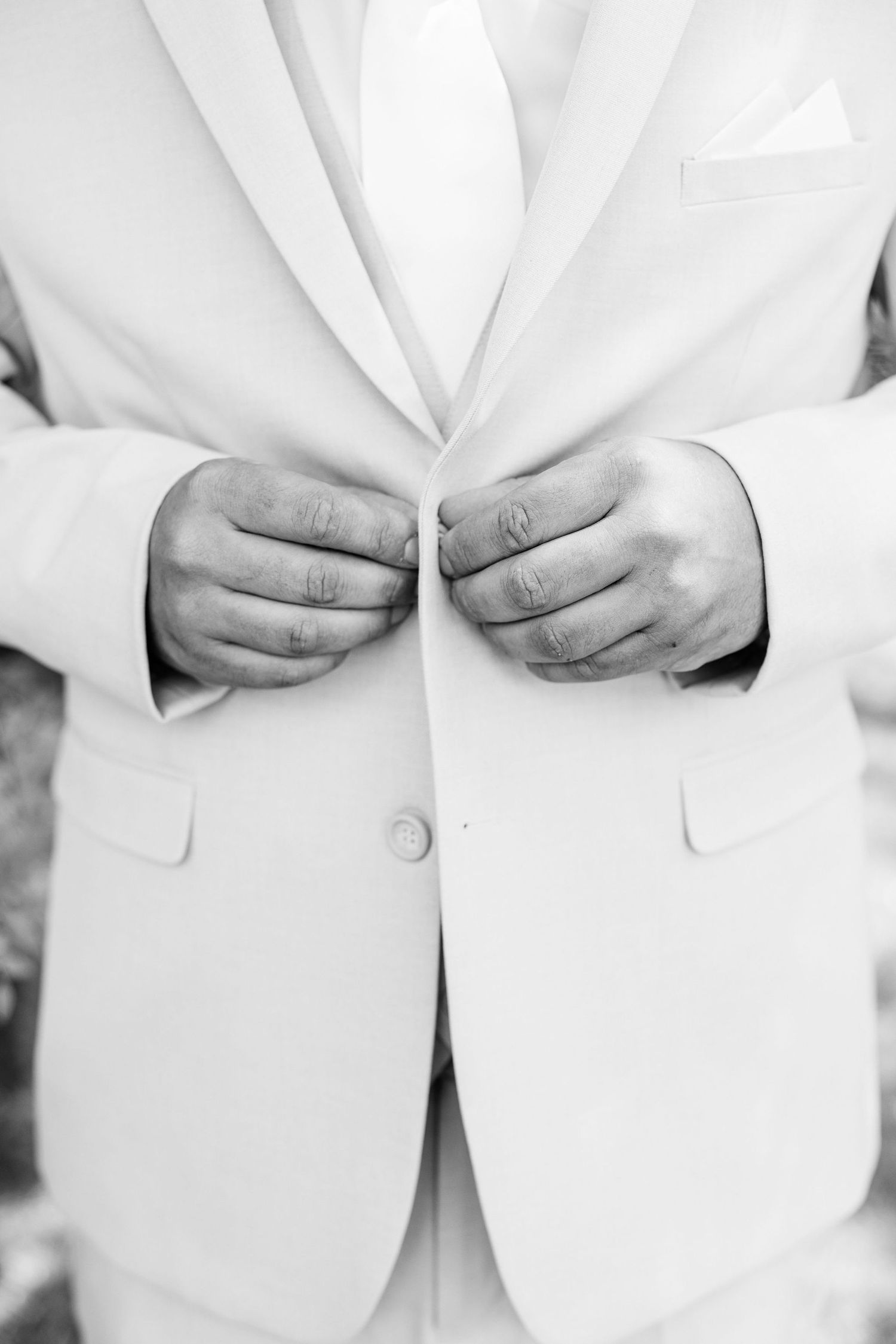 Portraits of groom getting ready  at Lapeer Country Club wedding in Michigan