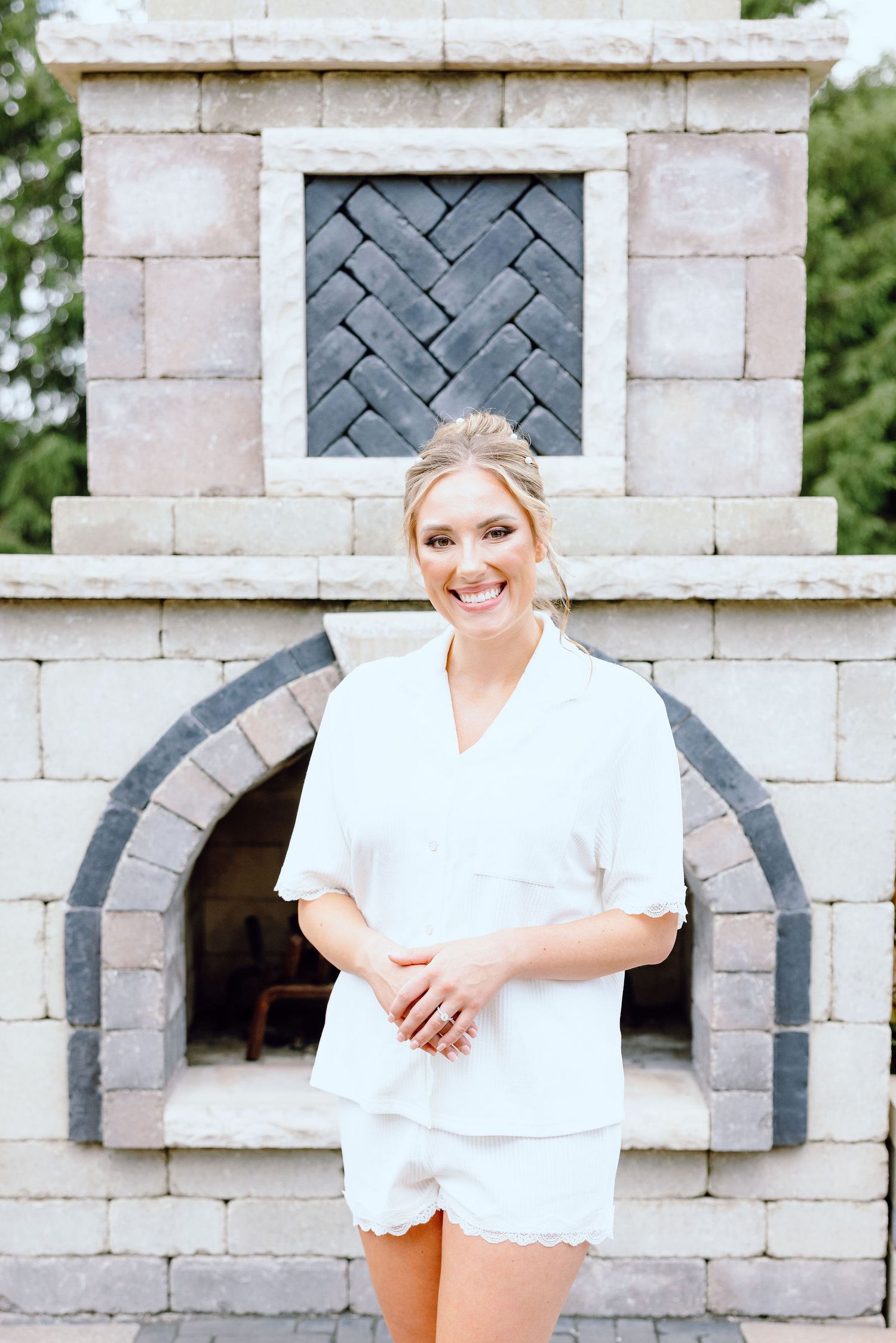 Bride in getting ready pajamas at Lapeer Country Club wedding in Michigan