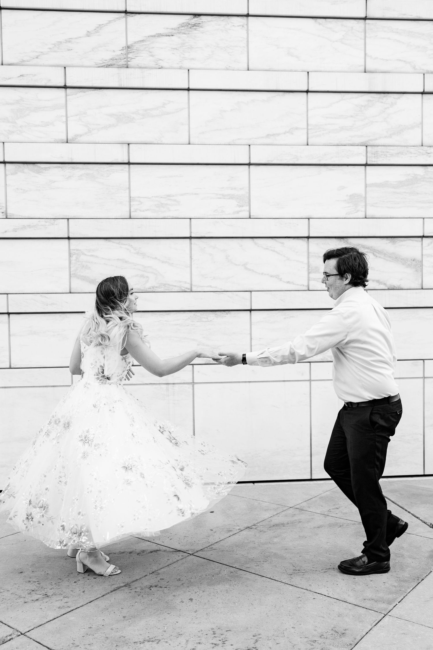 Engaged couple swing dancing at Detroit Institute of Arts engagement session in Detroit, MI
