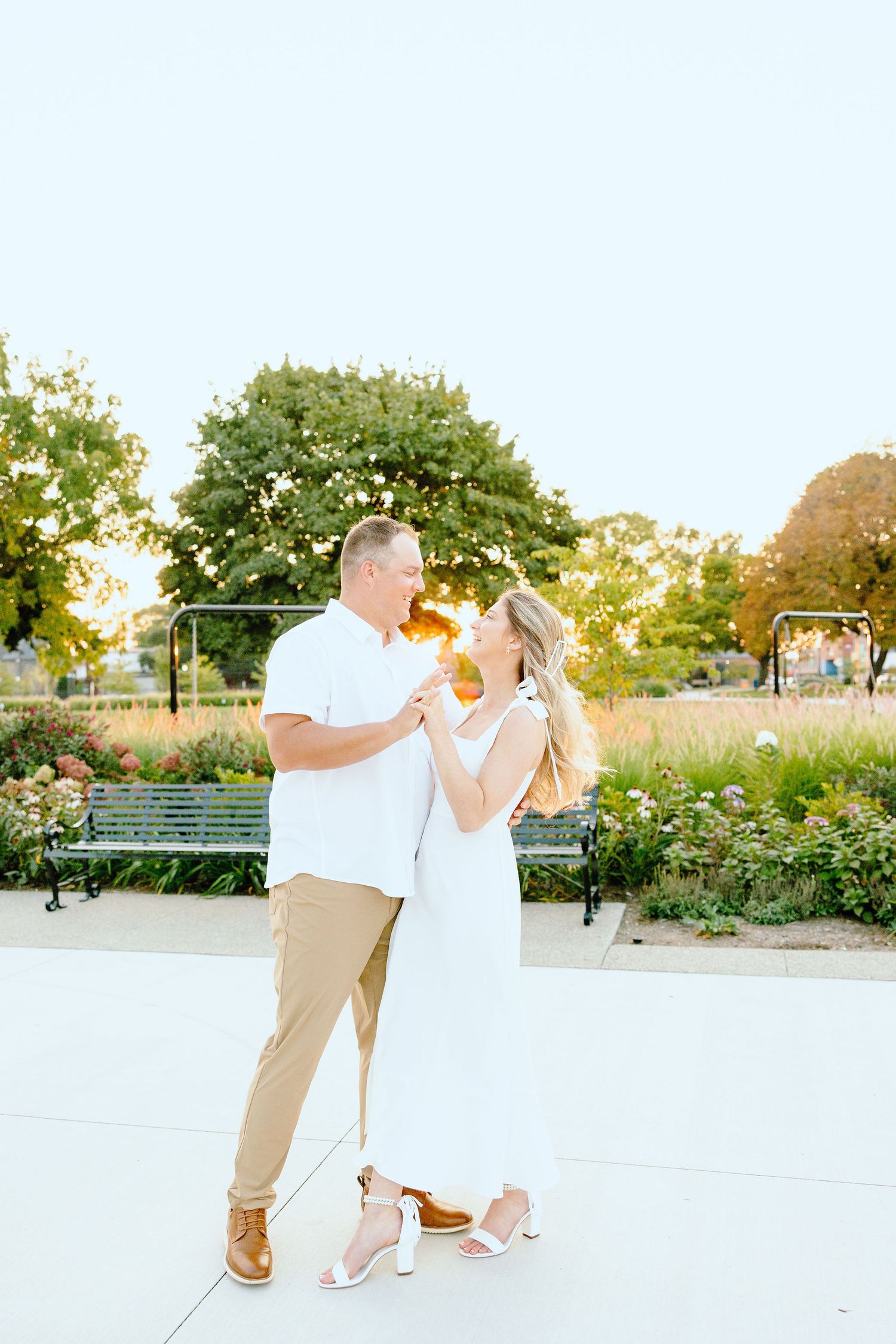 Engaged couple dipping at Michigan Central Station summer engagement session in Detroit, MI