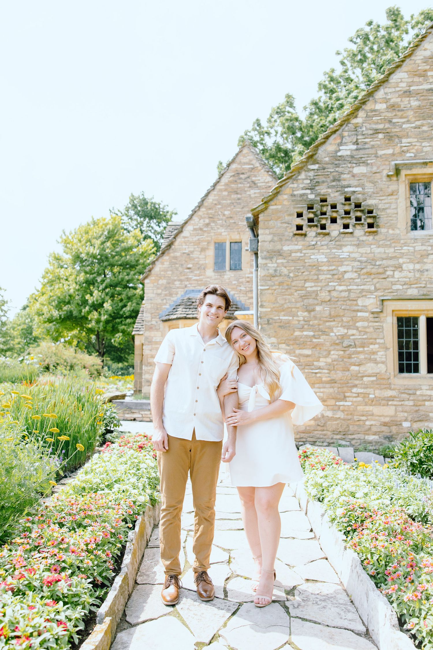 Engaged couple embracing at Greenfield Village in Dearborn, MI