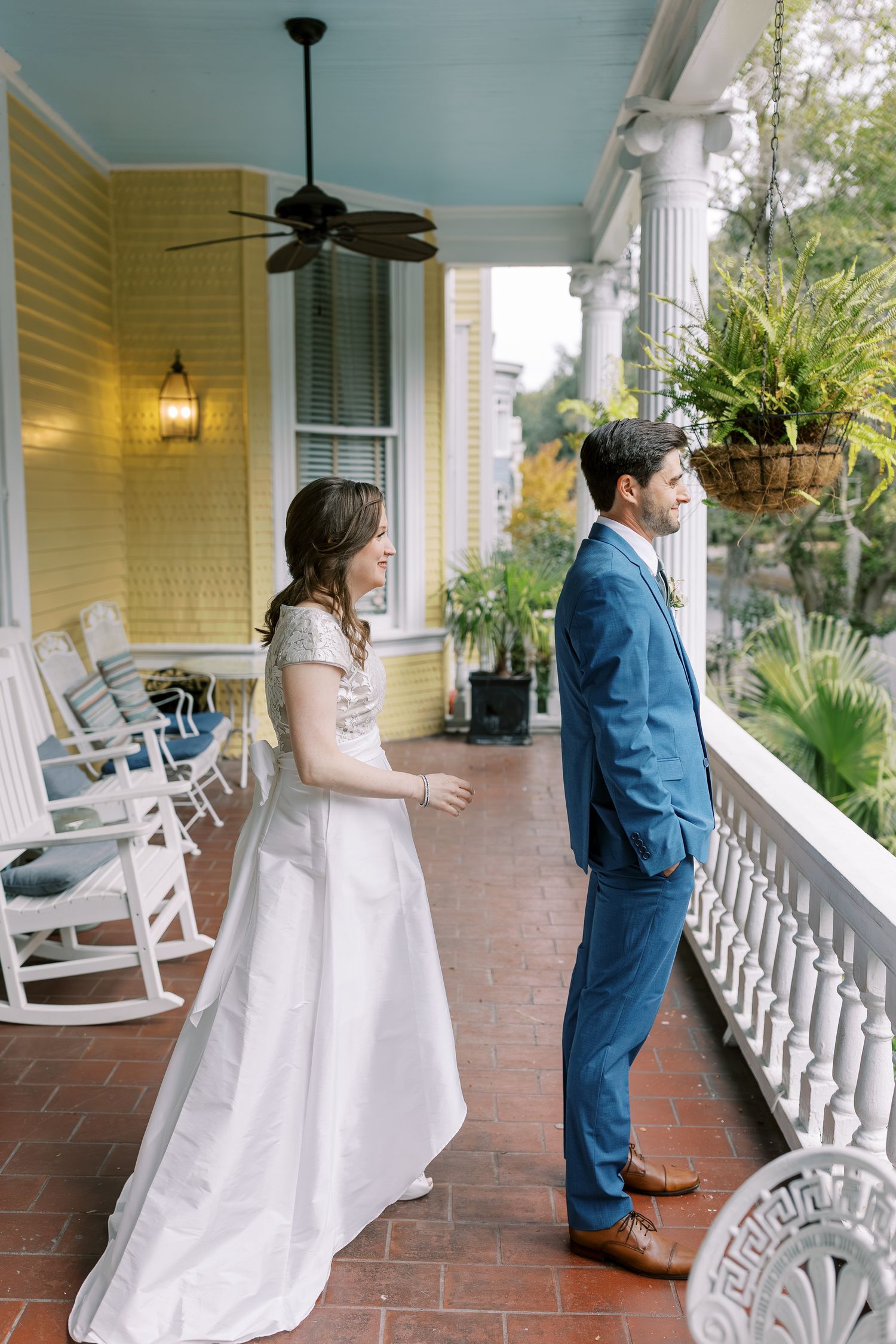 A series of candid moments on a charming yellow house porch with white rocking chairs and terra cotta flooring.