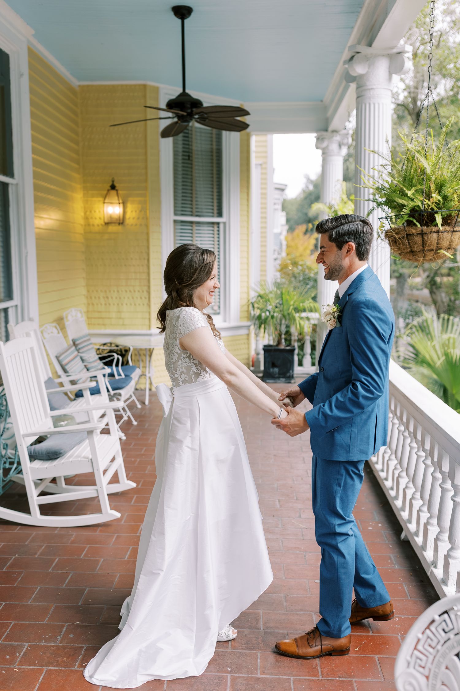 A sequence of first look photos showing a couple meeting on a yellow-walled porch with white rocking chairs.
