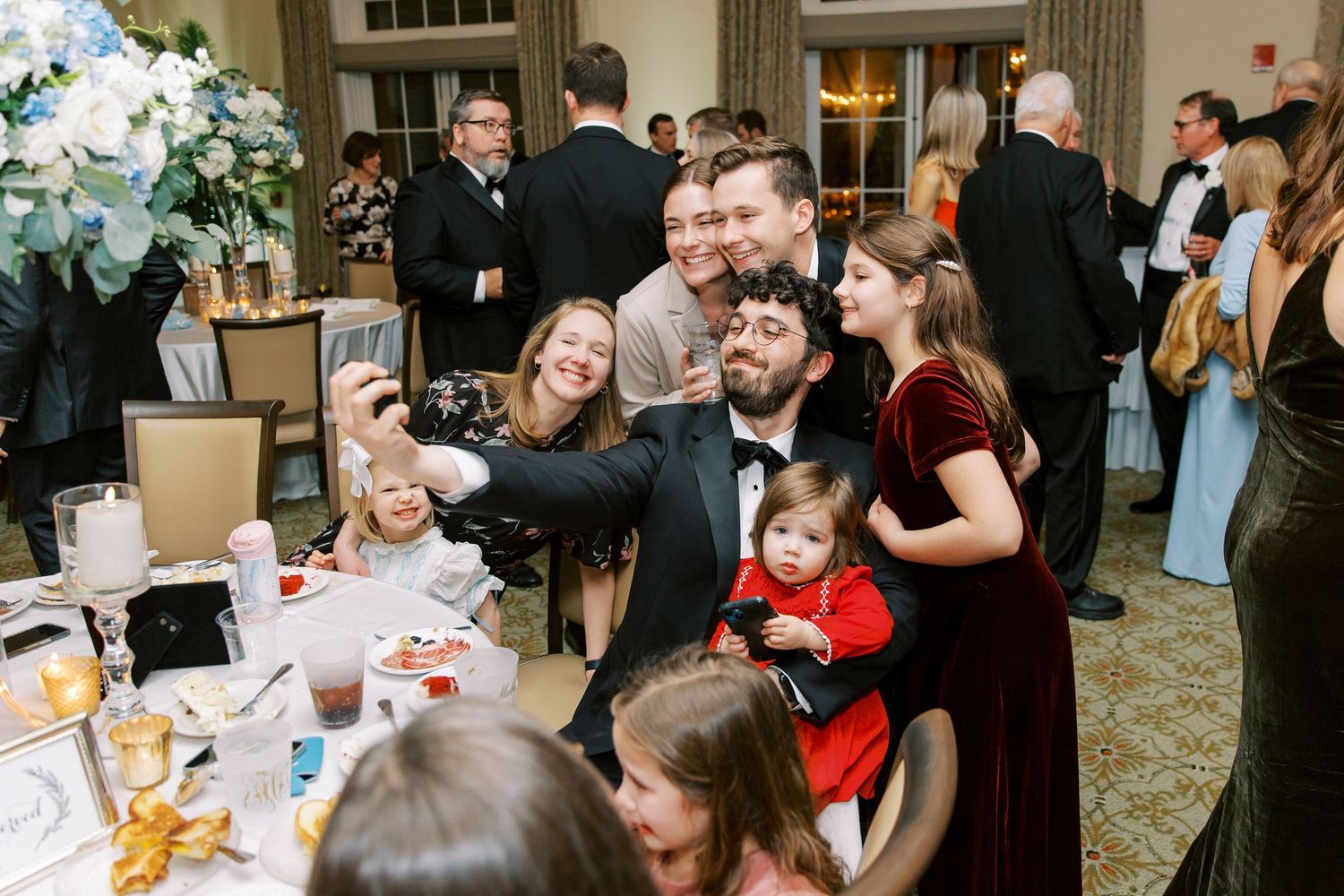 Wedding reception candid moments with guests enjoying celebrations in an elegant venue.