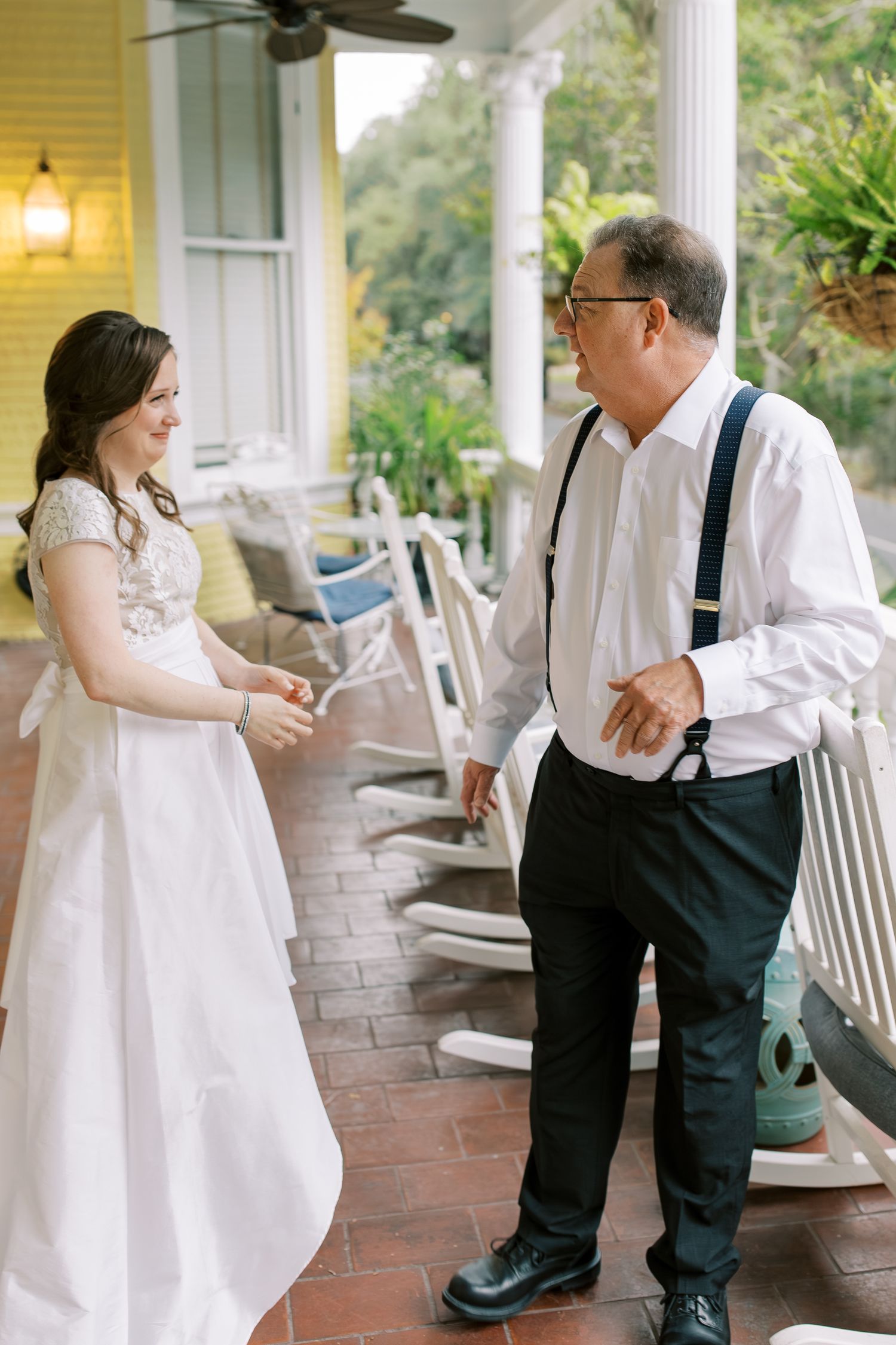 Sweet interactions between wedding party members on a classic southern style porch.
