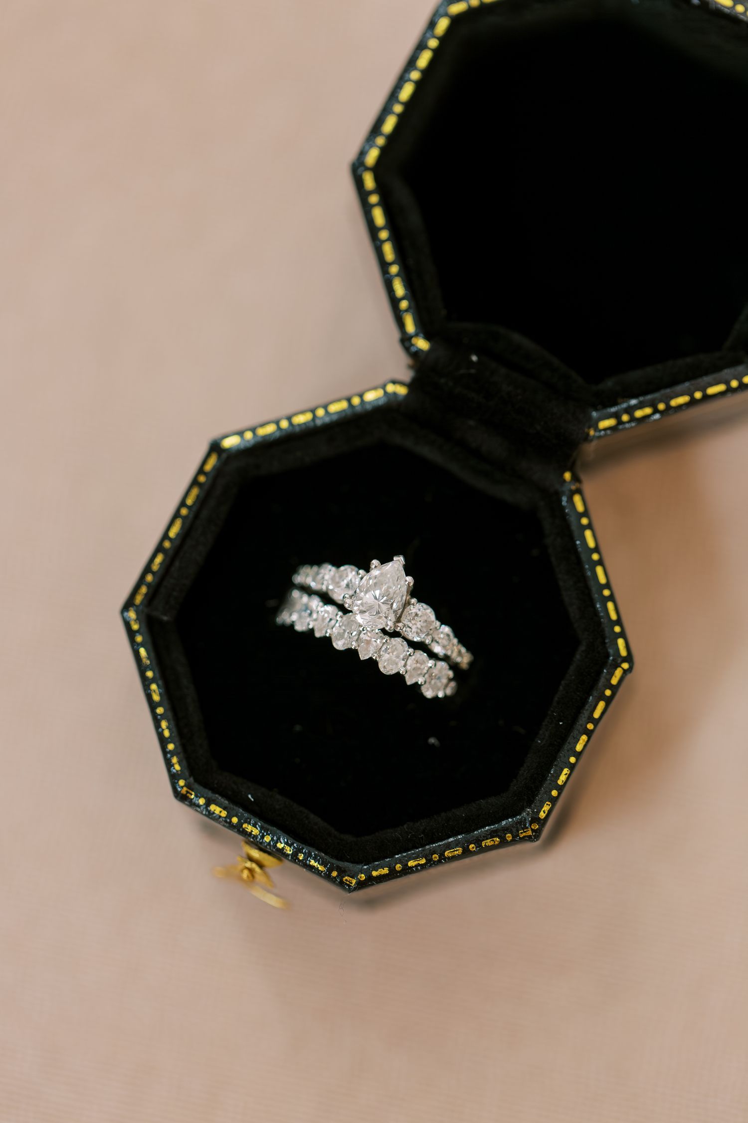 Sparkling diamond engagement ring displayed in an elegant black octagonal ring box.
