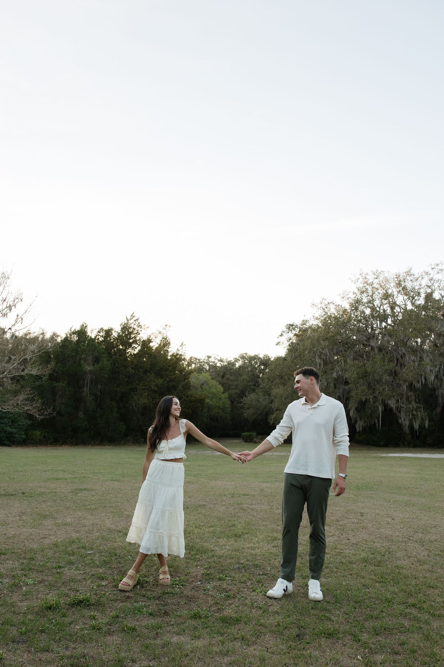 An engaged Tampa couple is together at Philippe park captured by Michaela Gom Photography.